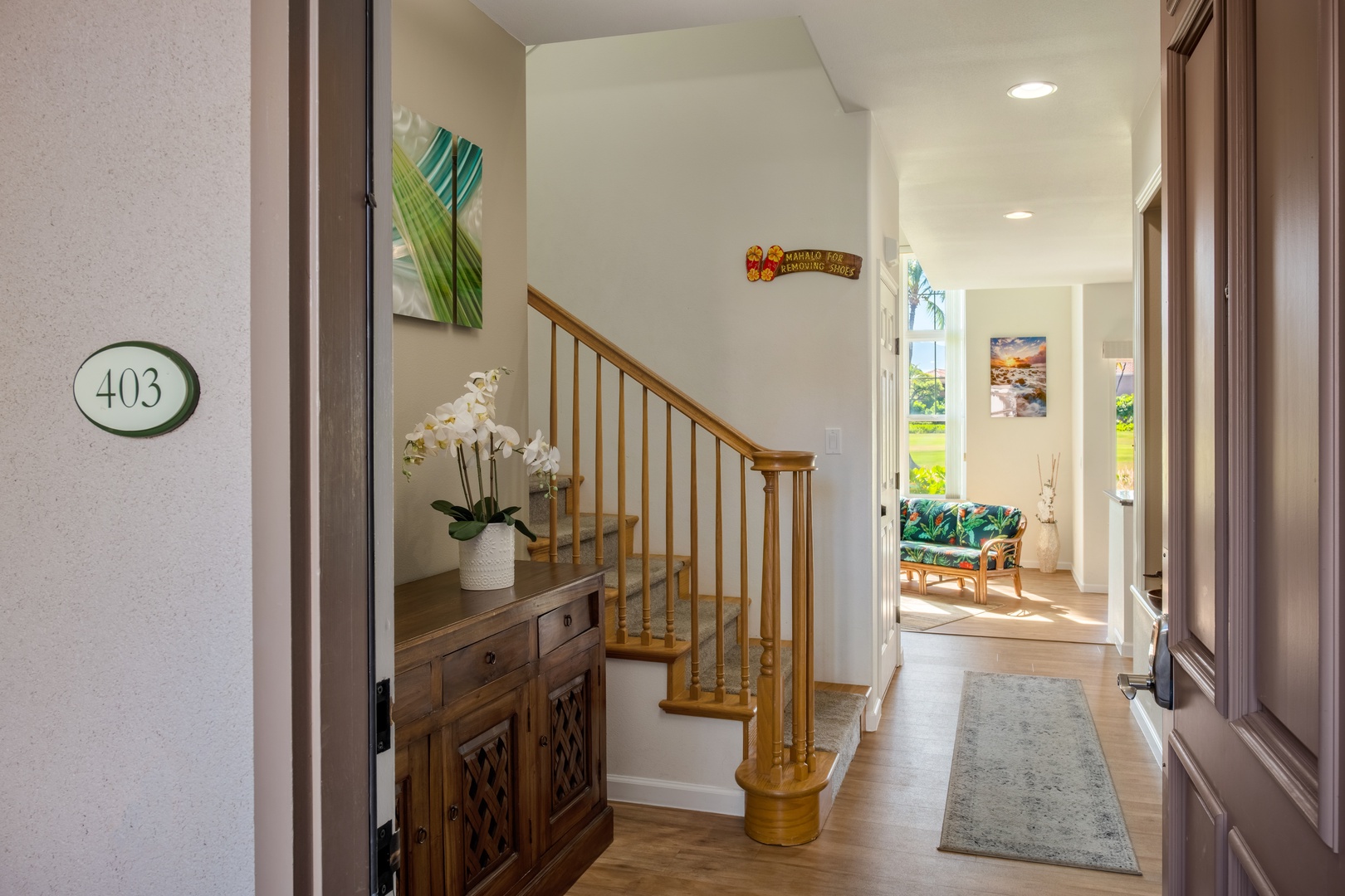 Waikoloa Vacation Rentals, Waikoloa Colony Villas 403 - Elegant entryway with a welcoming staircase and tasteful floral accents.