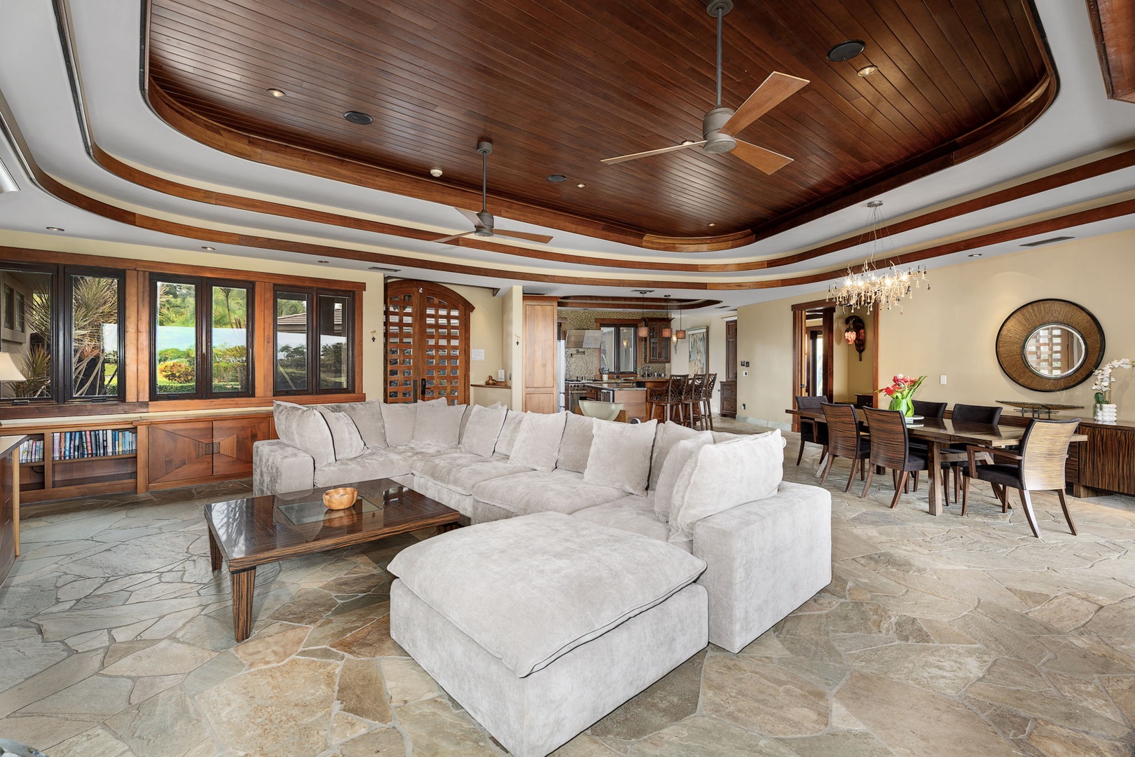 Kamuela Vacation Rentals, Hale Konane - Cozy lounge area with elegant woodwork, ideal for intimate gatherings.