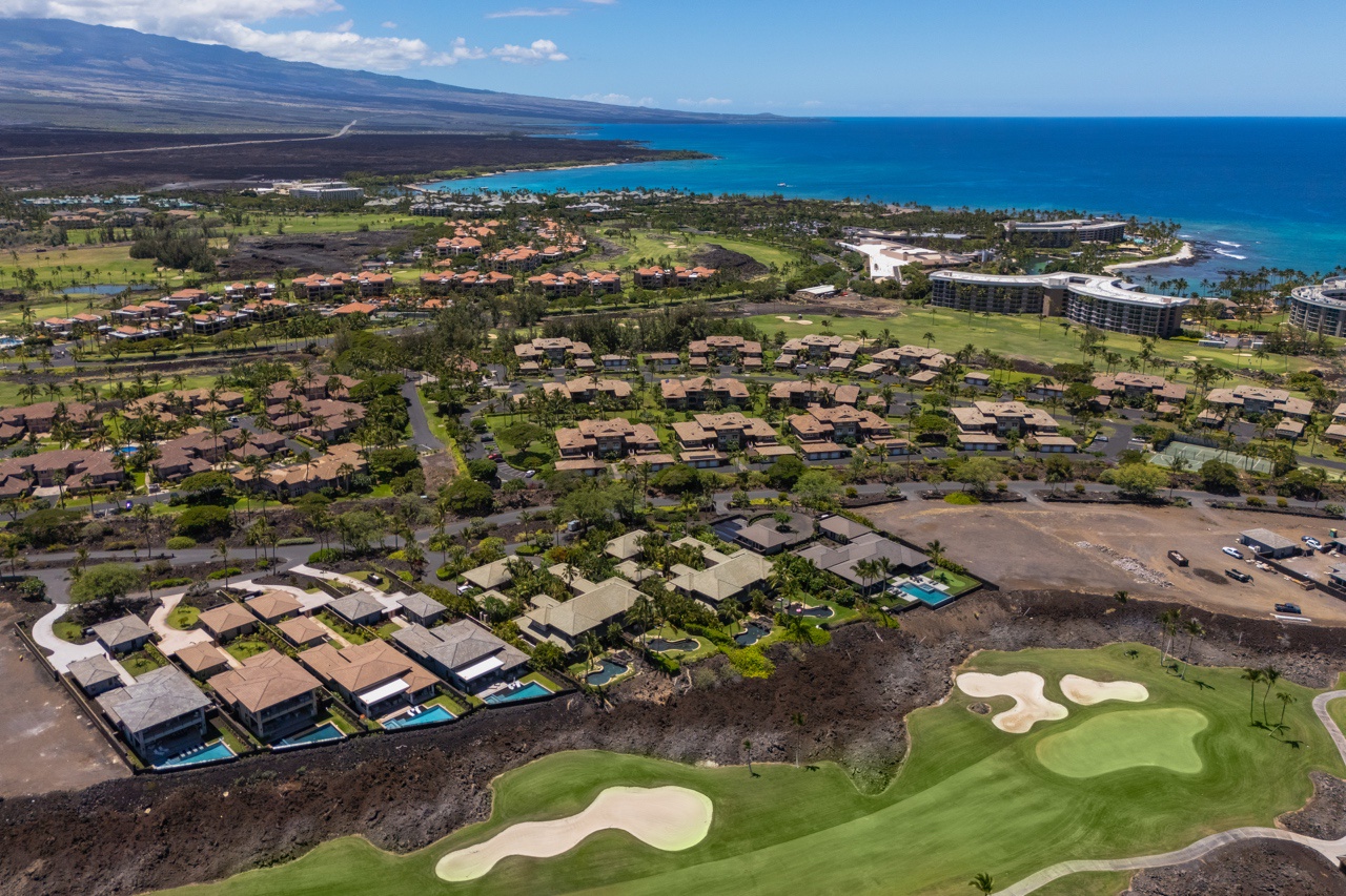 Waimea Vacation Rentals, 5BD Mauna Lani Lux Golf Estate (4) at One Ocean - This aerial view captures the breathtaking expanse of a coastal golf community, beautifully integrated into its natural surroundings.