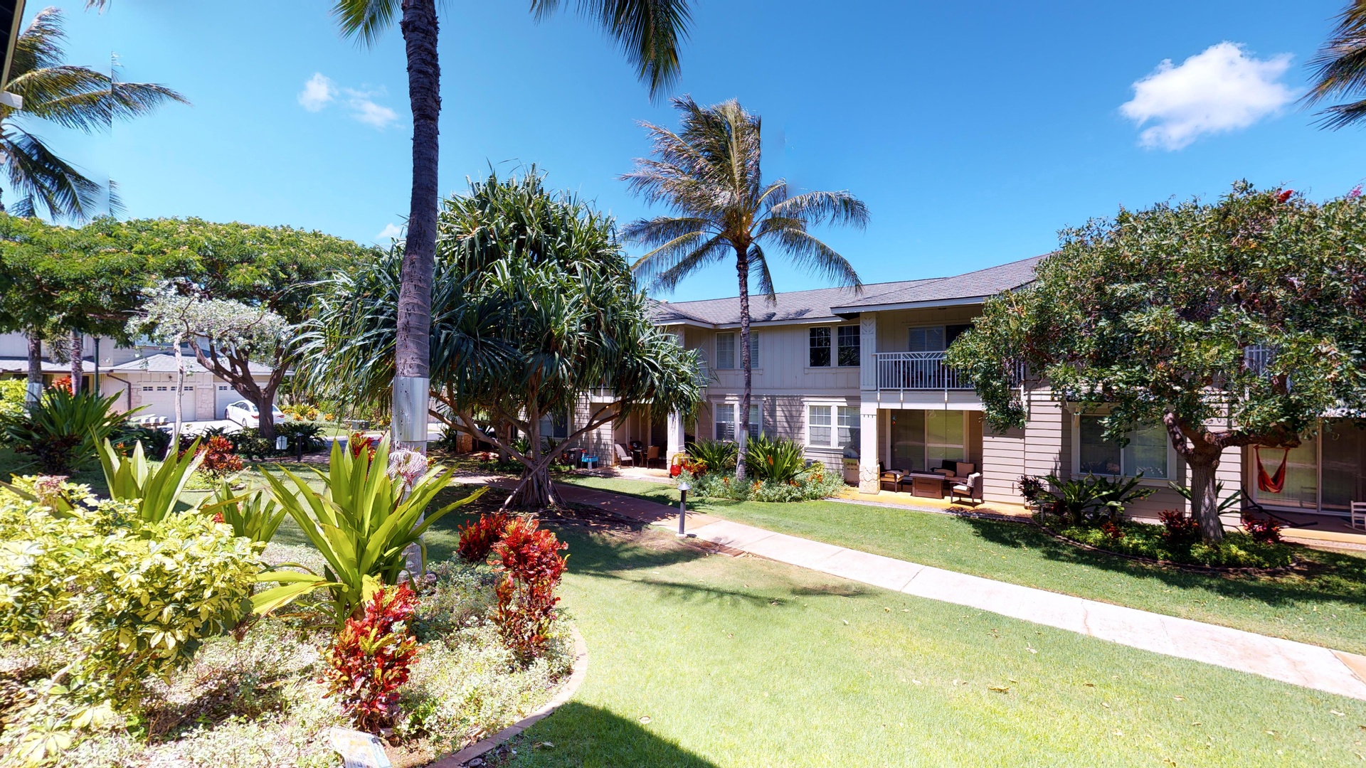 Kapolei Vacation Rentals, Ko Olina Kai 1035D - An outside view of the condo and manicured lawns.