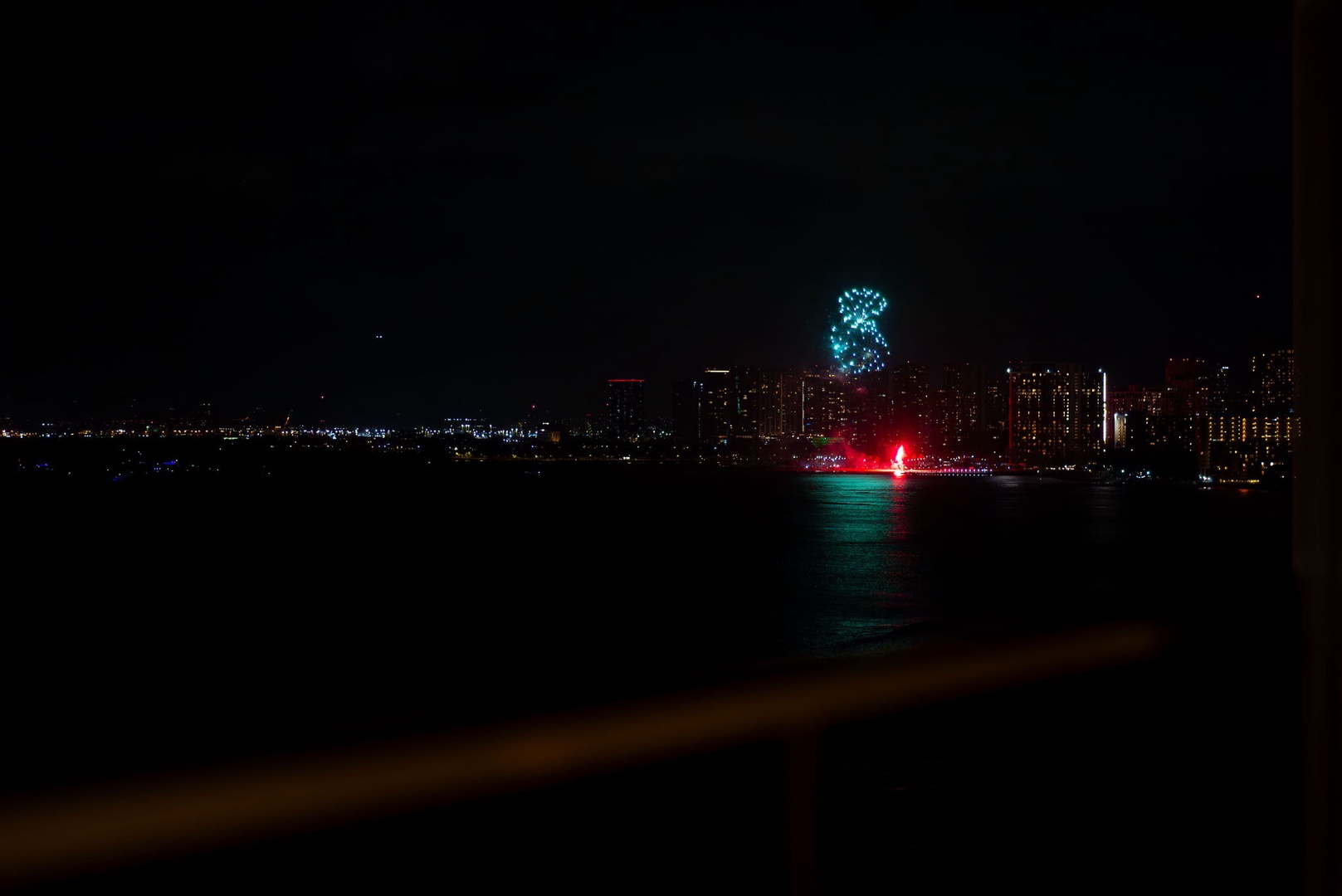 Honolulu Vacation Rentals, Hale Kaimana - Vibrant fireworks lighting up the night sky over the water.