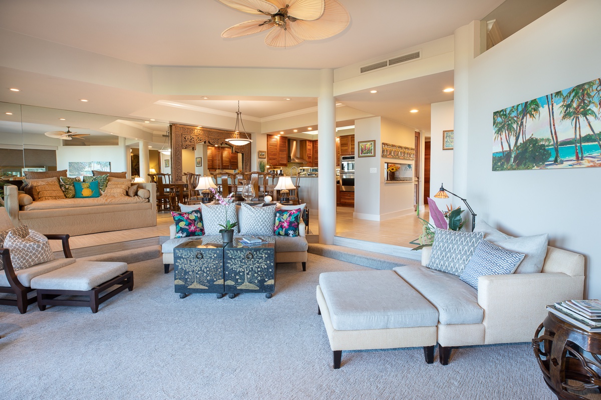 Kamuela Vacation Rentals, Mauna Lani Point B105 - The ocean is immediately seen upon opening the front door where beautiful new tiling flows from the entryway into the fully equipped kitchen