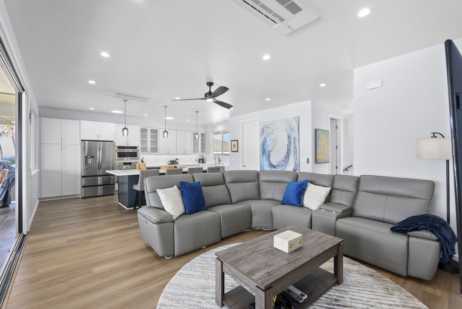 Waianae Vacation Rentals, Oceanfront Luxury Dream Estate - Spacious oceanview living room with sectional seating, coastal artwork, and central A/C.