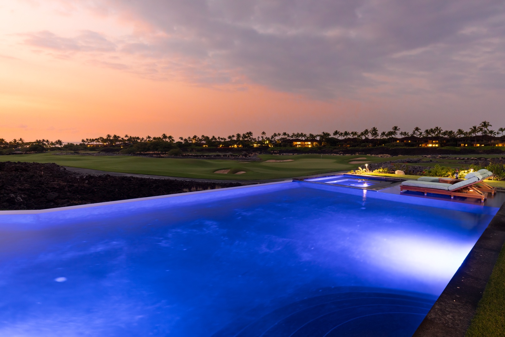 Kailua Kona Vacation Rentals, 5BD Ke Alaula Estate (144) at Hualalai Resort - Infinity pool glows at dusk, offering serene views of the ocean and fairway.