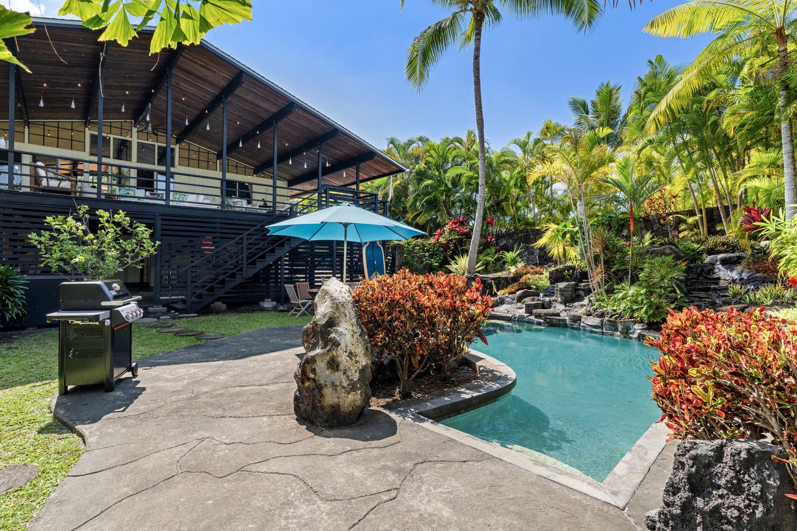 Kailua Kona Vacation Rentals, Mai Tai Manor - Relax by your private tropical pool surrounded by lush palms and vibrant gardens, with BBQ ready for sunset dinners.