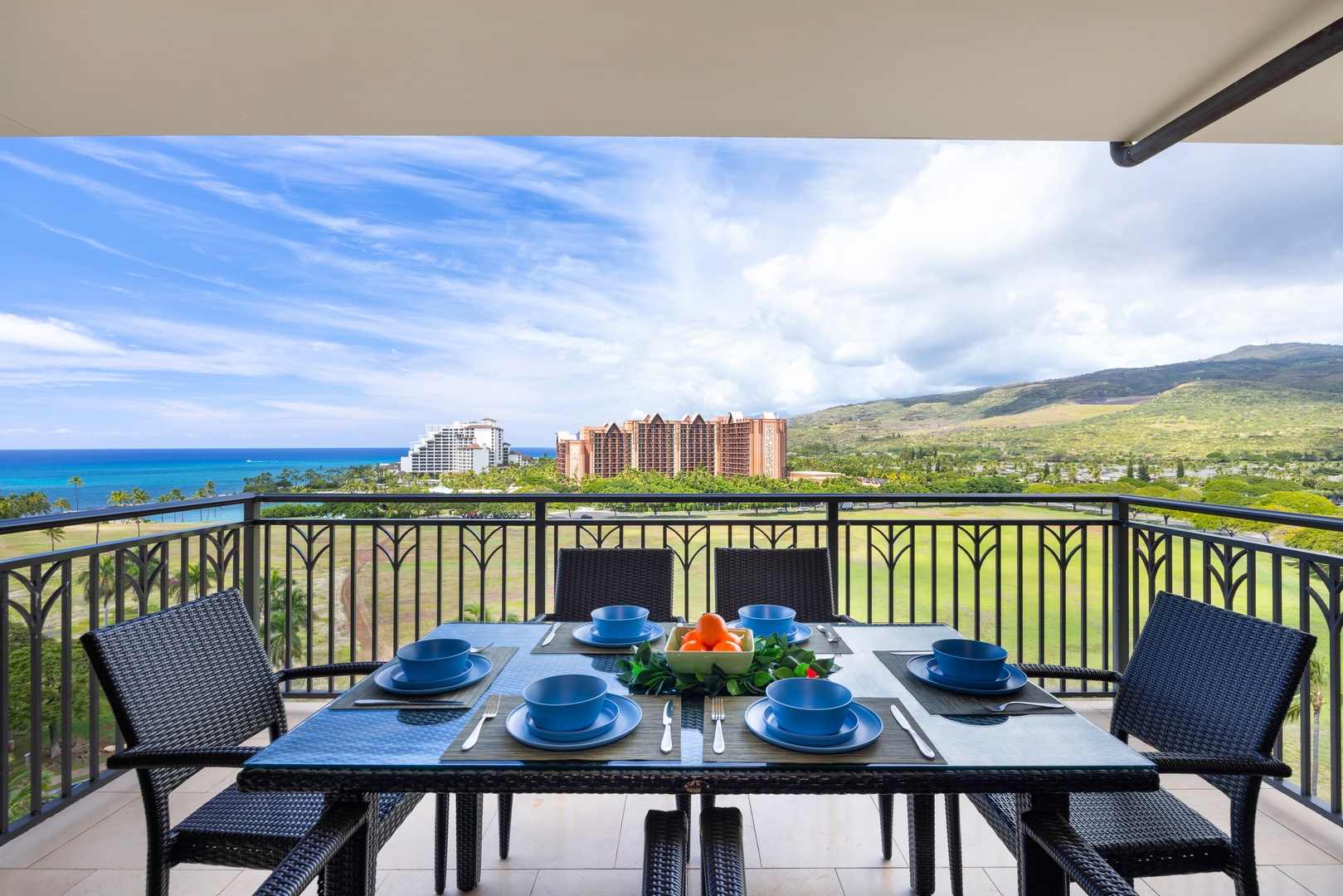 Kapolei Vacation Rentals, Ko Olina Beach Villas O1111 - Savor breakfast on your private balcony with stunning ocean views, mountains, and resort scenery stretching to the horizon.