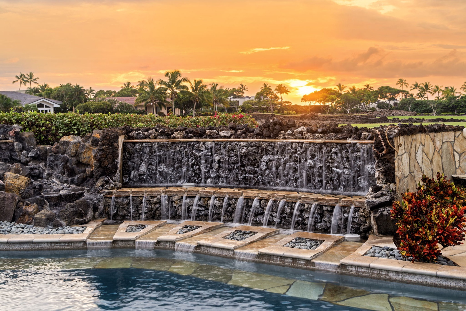 Kamuela Vacation Rentals, Hale Konane - Golden hour lights up the cascading waterfall, creating a tranquil, picture-perfect setting.