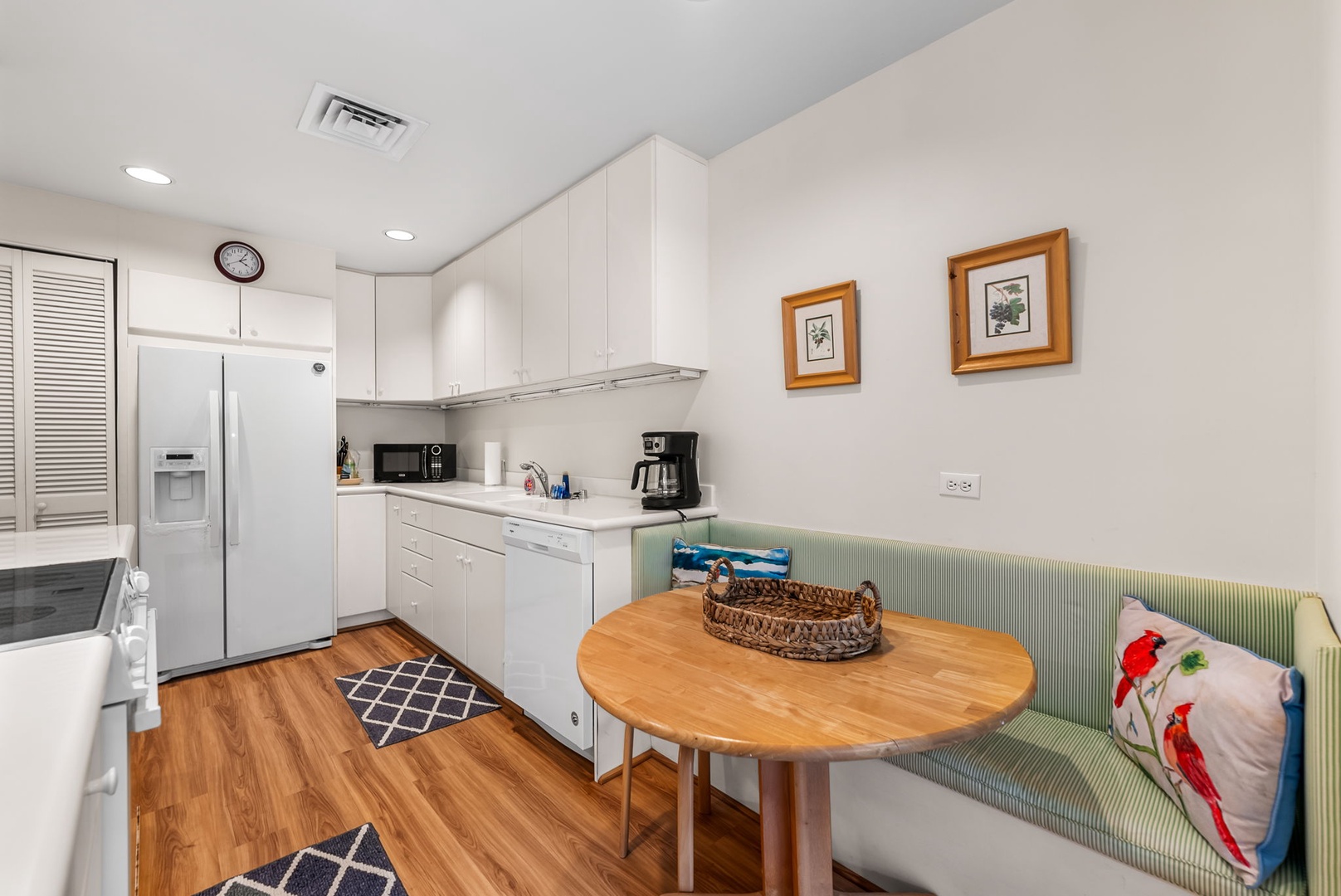 Honolulu Vacation Rentals, Kahala Beachfront Villa - The kitchen offers top tier appliances to make meal prepping a breeze and a breakfast nook on the side.