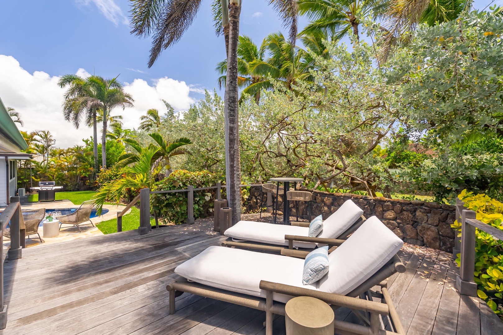 Kailua Vacation Rentals, Kailua Beach House - Soak up the sun or sip coffee on the shaded lounge deck surrounded by palms.