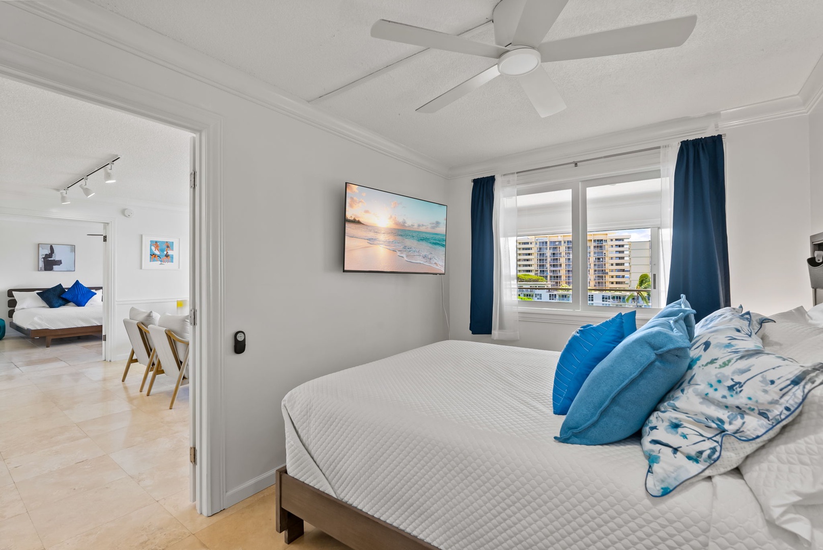 Honolulu Vacation Rentals, Colony Surf Getaway - The primary bedroom has a queen bed, TV and ensuite bath.