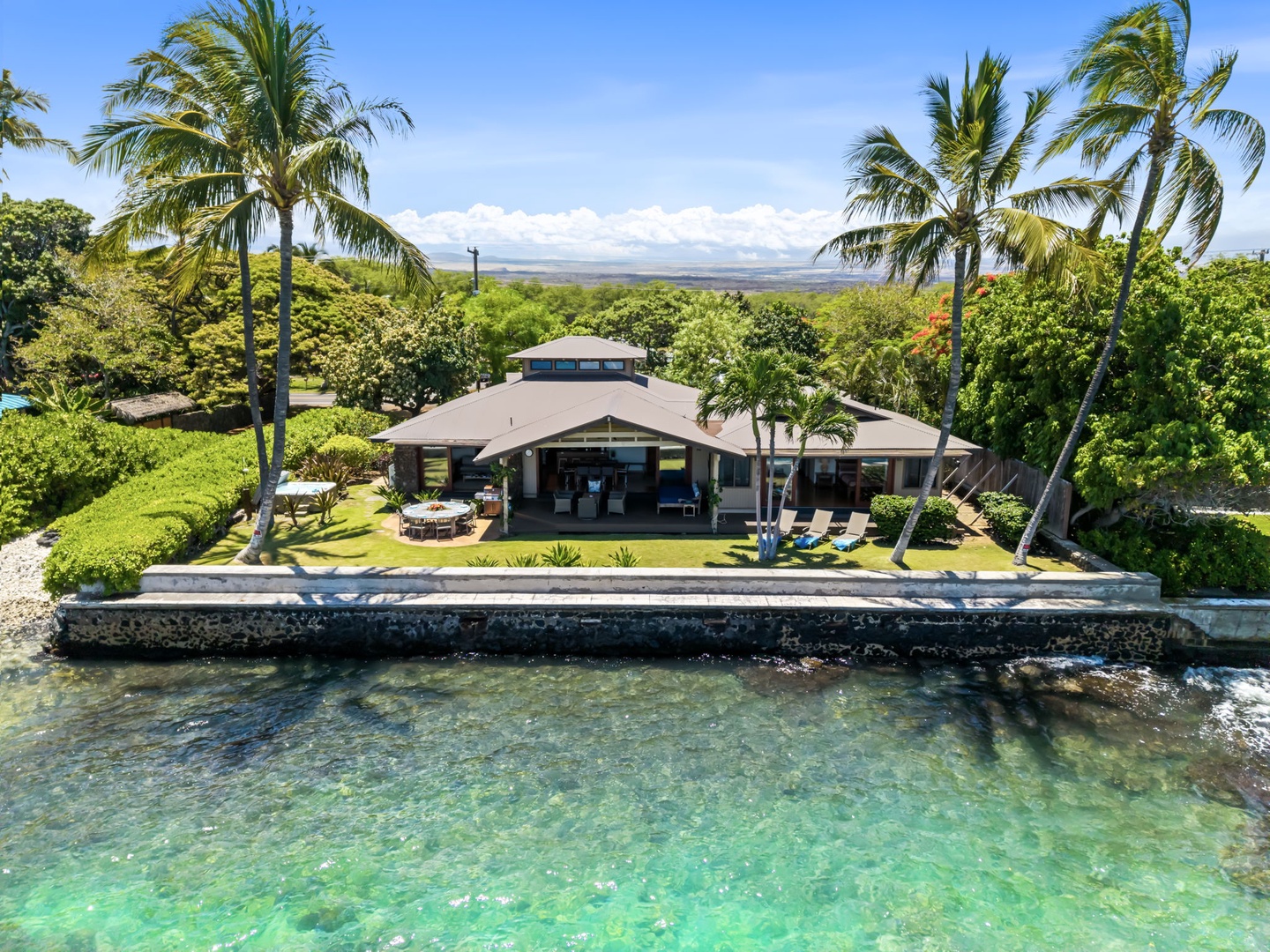 Kamuela Vacation Rentals, Island Time Retreat - Turquoise reef water wraps the seawall, the lawn running right to the ocean's edge.