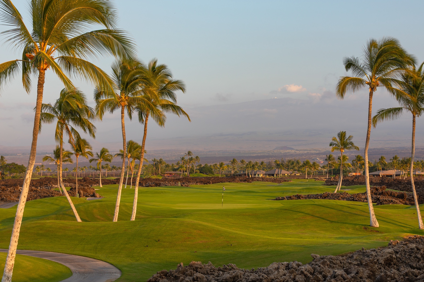 Kamuela Vacation Rentals, 5BD Mauna Lani Lux Ocean Estate (OE12) at One Ocean - Championship golf course with tropical palms and volcanic landscape creates a stunning Hawaiian setting for your perfect vacation round.