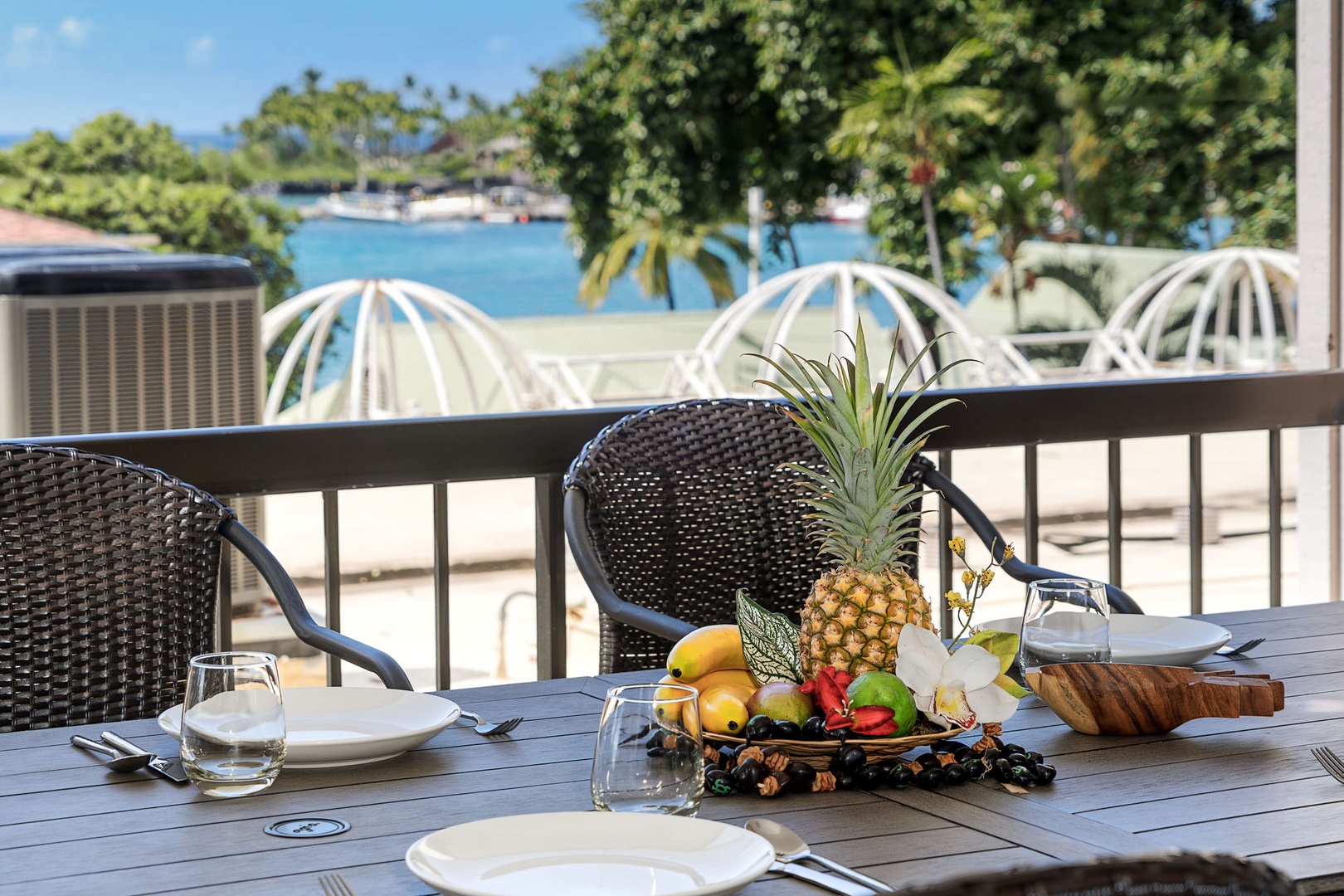 Kailua Kona Vacation Rentals, Kona Plaza 201 - Cozy lanai space with lounge chairs to relax and take in the serene surroundings.