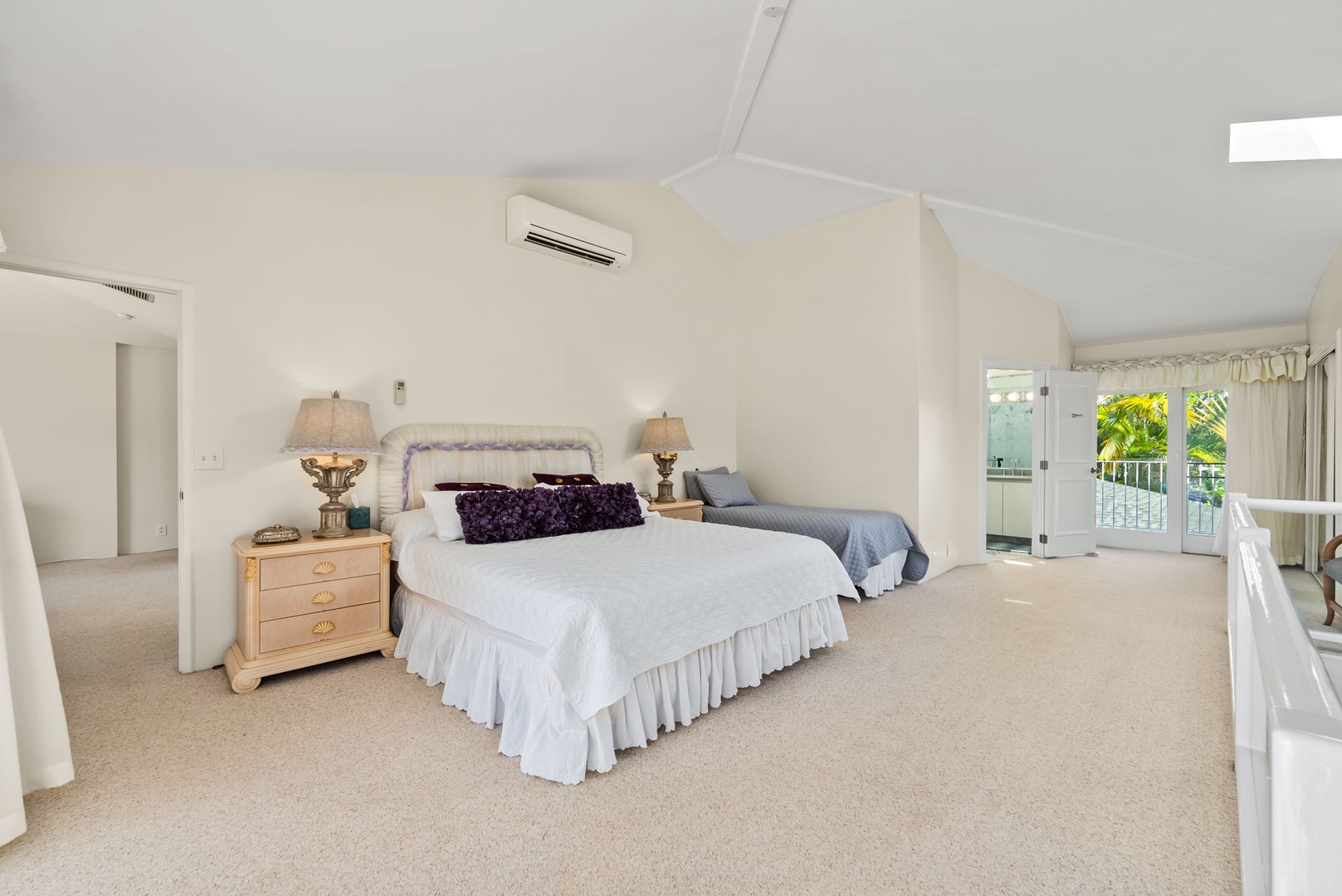 Honolulu Vacation Rentals, Kahala Oasis - Spacious second guest suite with a king and a twin bed and a skylight, filling the room with soft, natural light for a peaceful ambiance.