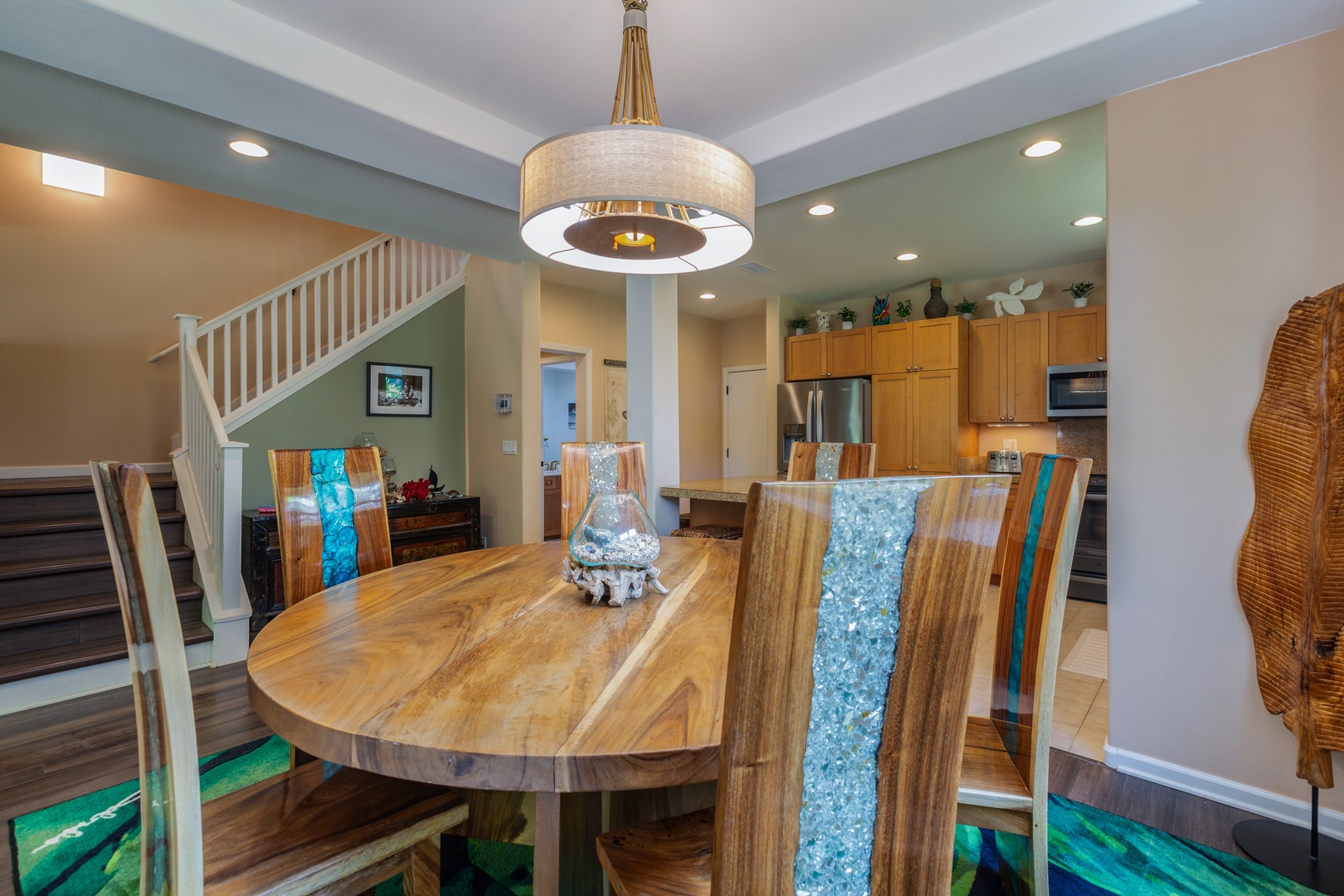 Princeville Vacation Rentals, Pualani Villa - A round dining table with seating for six creates a warm and inviting space for gatherings.