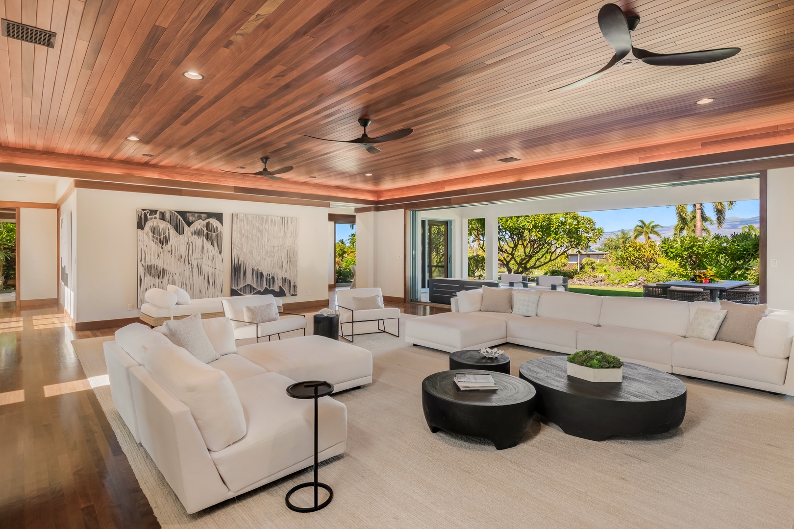 Kamuela Vacation Rentals, Champion Ridge Oasis - Stunning open living area with designer furnishing and ambient lighting. Expansive pocket doors open to the private backyard and lanai with majestic mountain views.