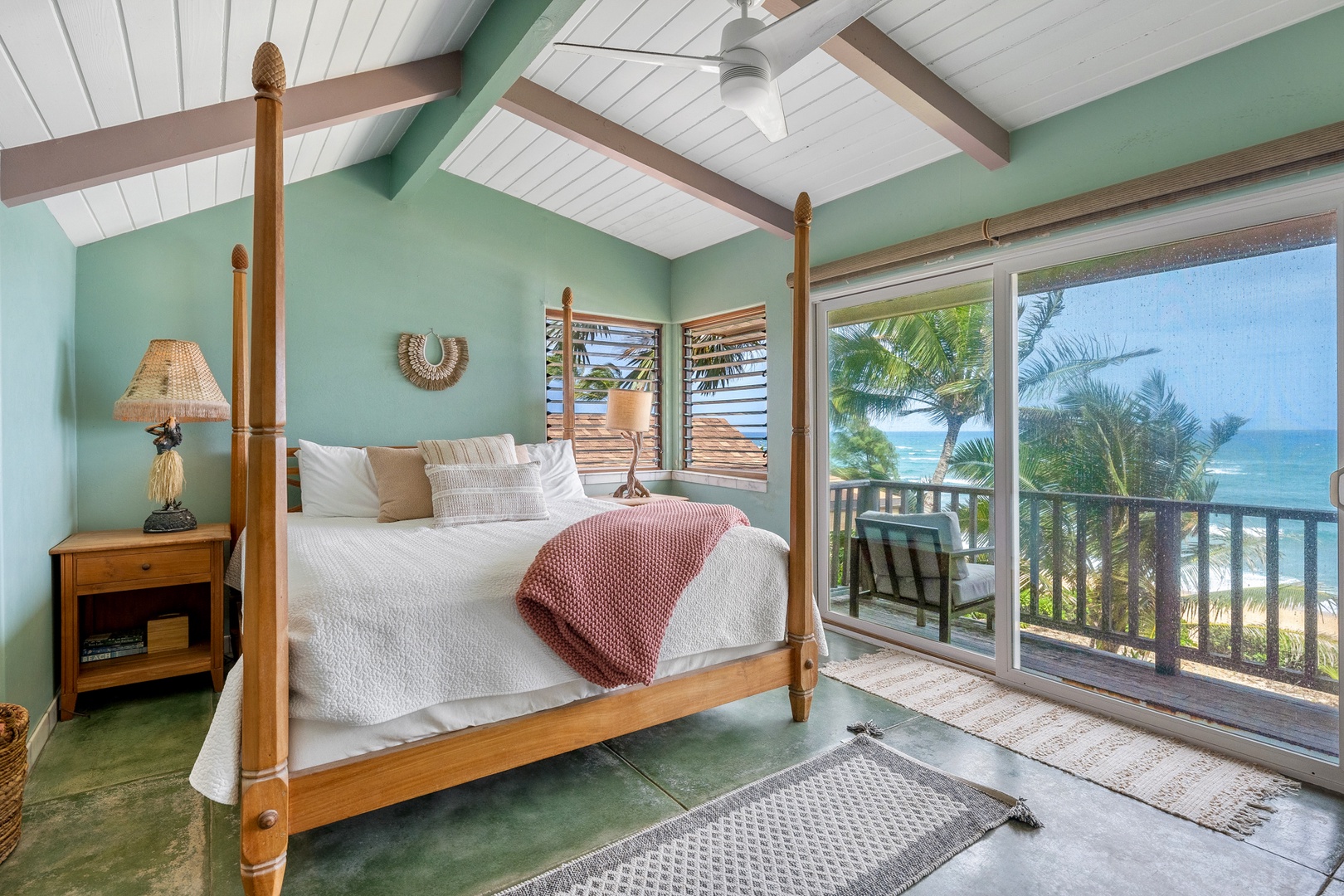 Hanalei Vacation Rentals, Hale Kepuhi - Witness the stunning ocean views from your cozy four-poster bed, where gentle sea breezes flow through tropical-style windows.