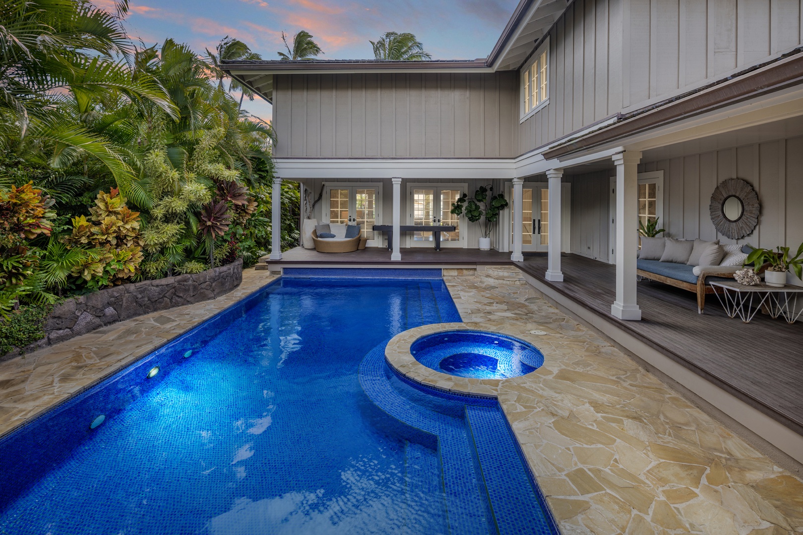 Honolulu Vacation Rentals, Moana Lani - Main House - A last swim as the courtyard lights come on and the sky turns pink.