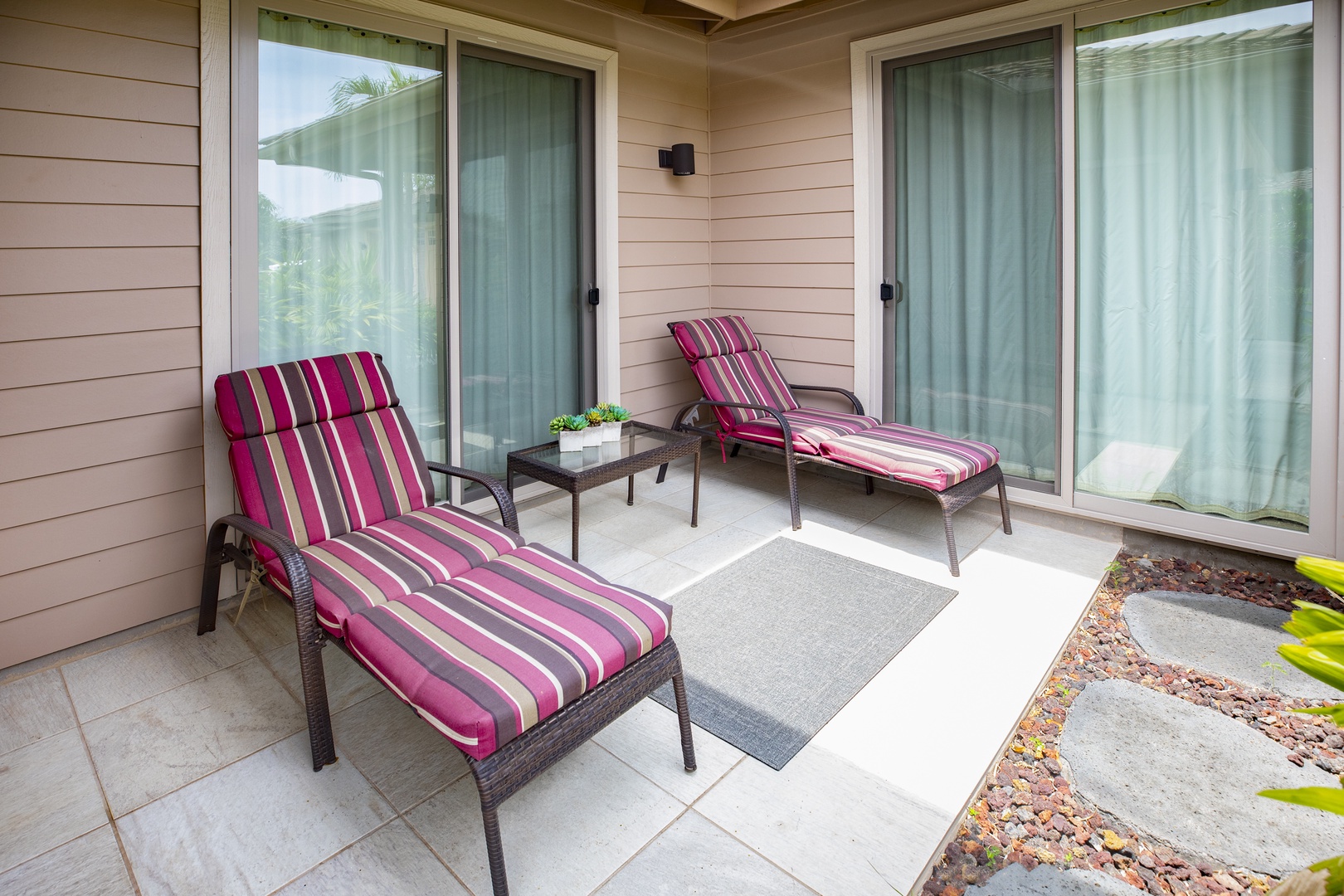 Kamuela Vacation Rentals, Mauna Lani KaMilo #503 - Start or end the day lounging in the sun on this private patio escape, complete with cushioned chaise seating.