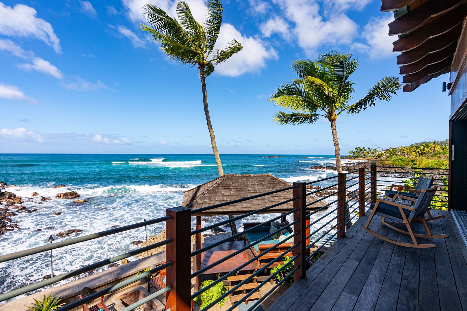 Haleiwa Vacation Rentals, Samurai House - Wooden deck overlooking the pristine shoreline and vibrant blue waters.