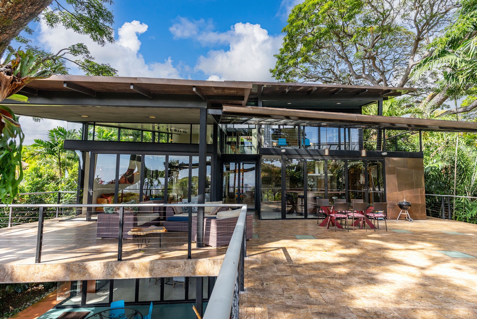 Honolulu Vacation Rentals, Tantalus Glass House (3 BD) - Modern glass architecture nestled in lush tropical surroundings with expansive outdoor lanai and natural canopy views.