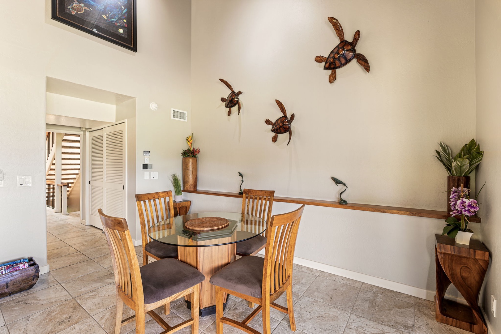 Kailua Kona Vacation Rentals, Kanaloa at Kona 1606 - The dining table sits near the entry, honu carvings watching over the room.