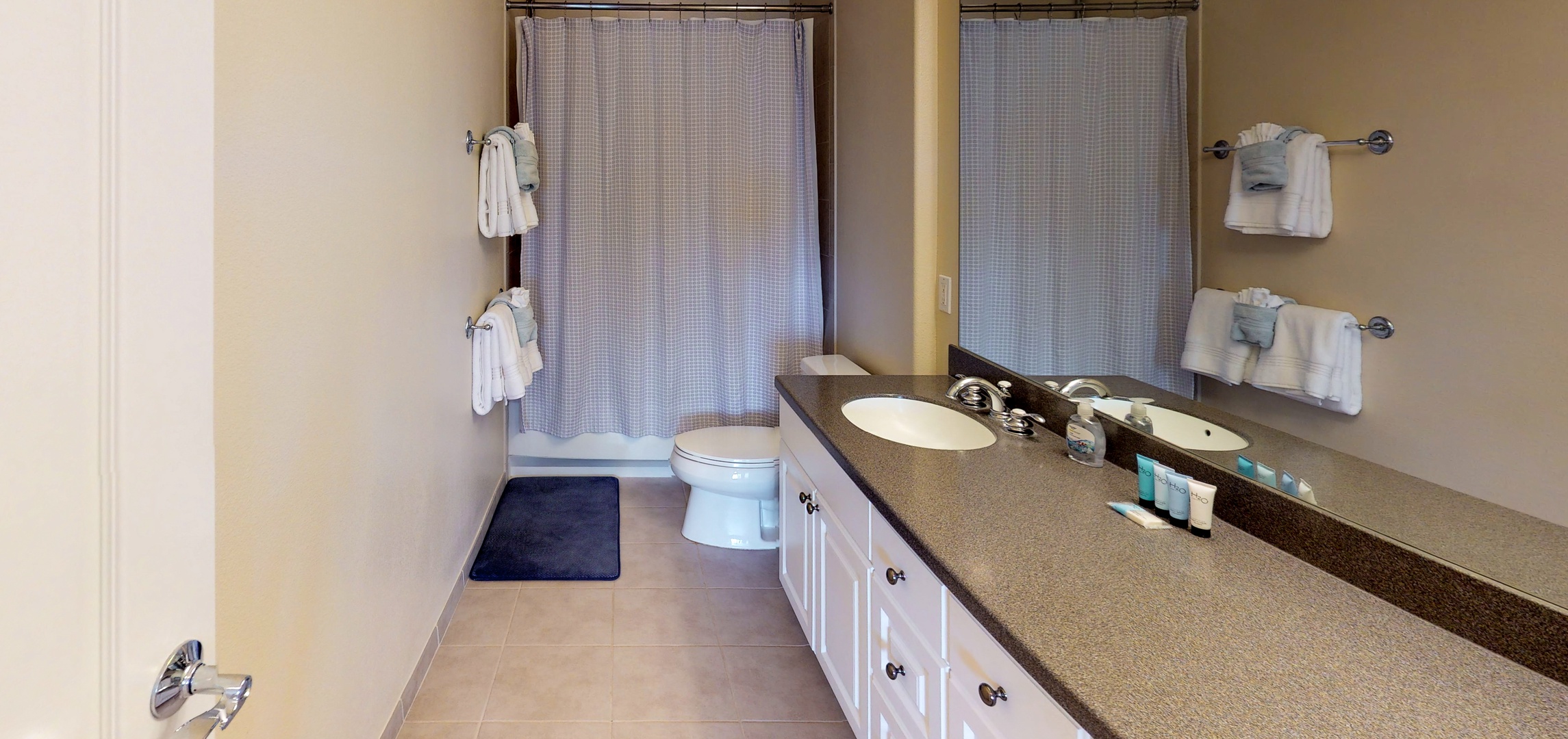 Kapolei Vacation Rentals, Ko Olina Kai 1065E - The primary guest bathroom with a large vanity and shower.