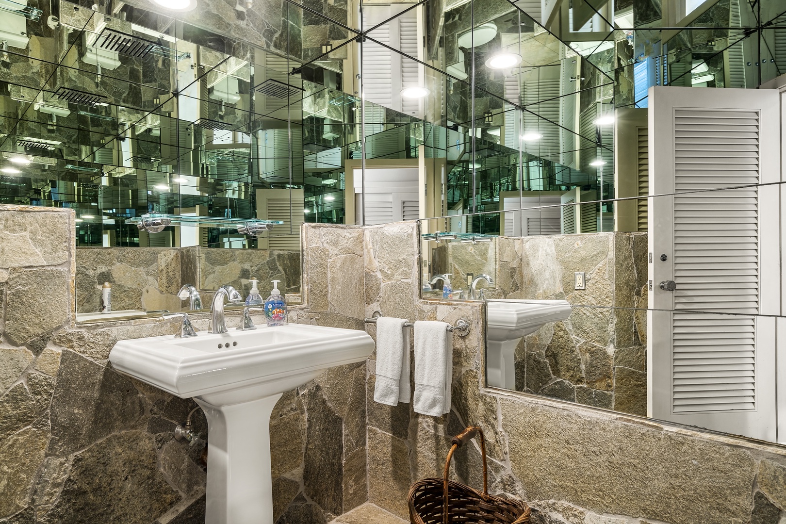 Kailua Kona Vacation Rentals, Ali'i Point #12 - Mirrored half bathroom off the main hallway—convenient and stylish for guests.