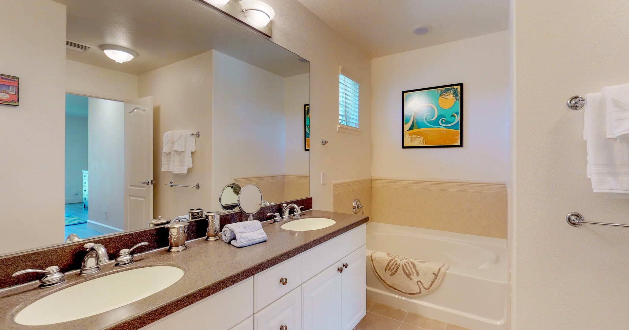 Kapolei Vacation Rentals, Ko Olina Kai 1051D - The primary guest bathroom upstairs with a soaking tub.