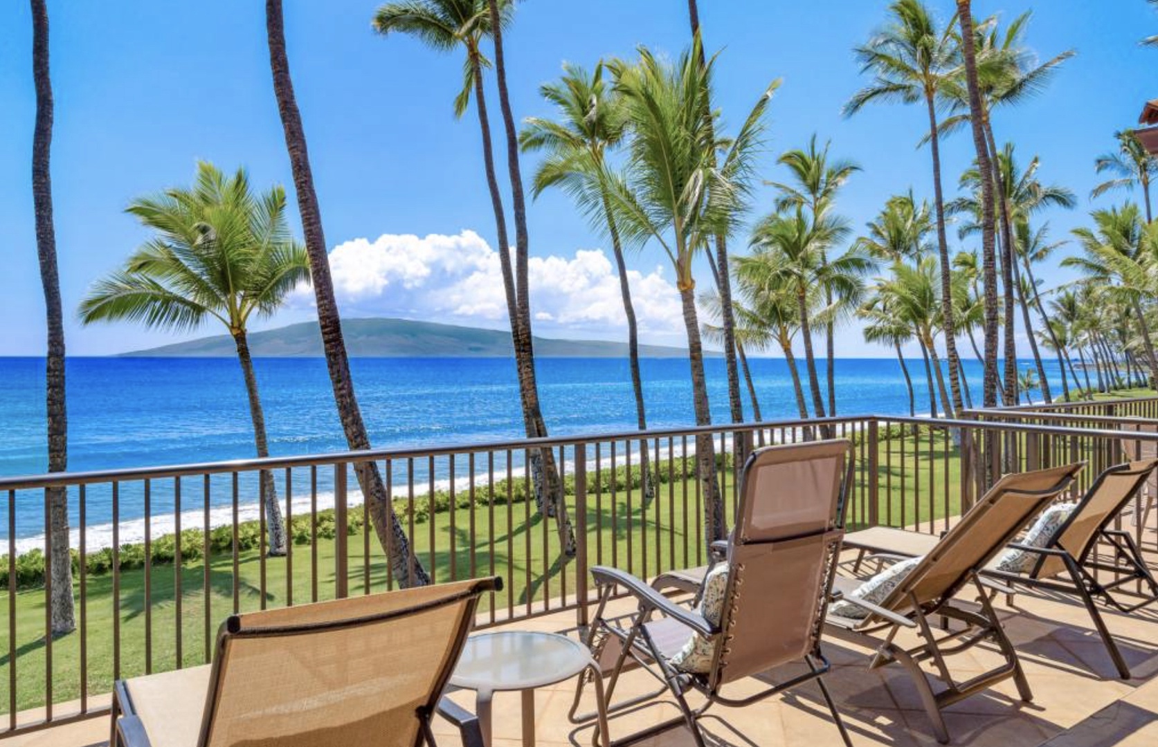 Lahaina Vacation Rentals, Puamana 240-3 - Relax on the patio with serene oceanfront scenery, perfect for unwinding.