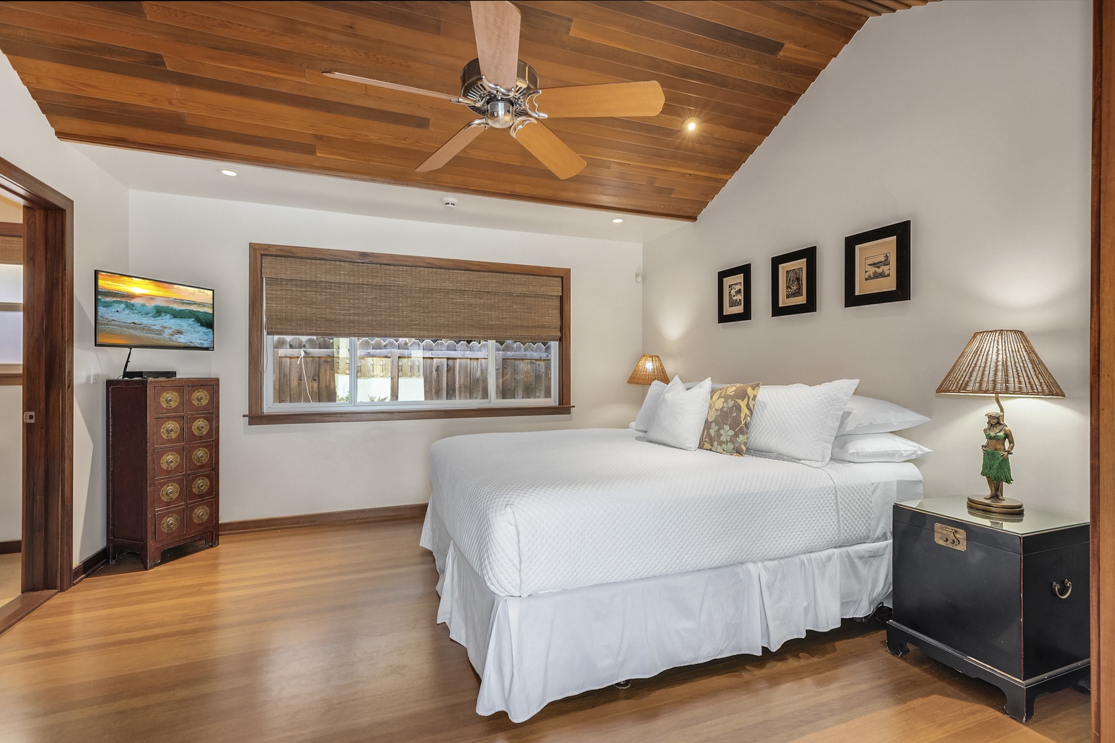 Honolulu Vacation Rentals, Hale Makai at Diamond Head - Second bedroom with vaulted ceiling, king bed, and warm wood tones for a relaxing retreat.