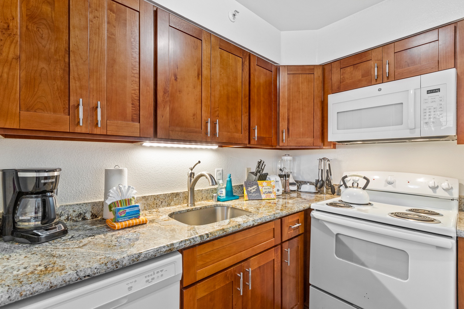 Lahaina Vacation Rentals, Royal Kahana 308 - The kitchen is fully equipped with modern appliances and granite countertops, perfect for preparing meals during your stay.