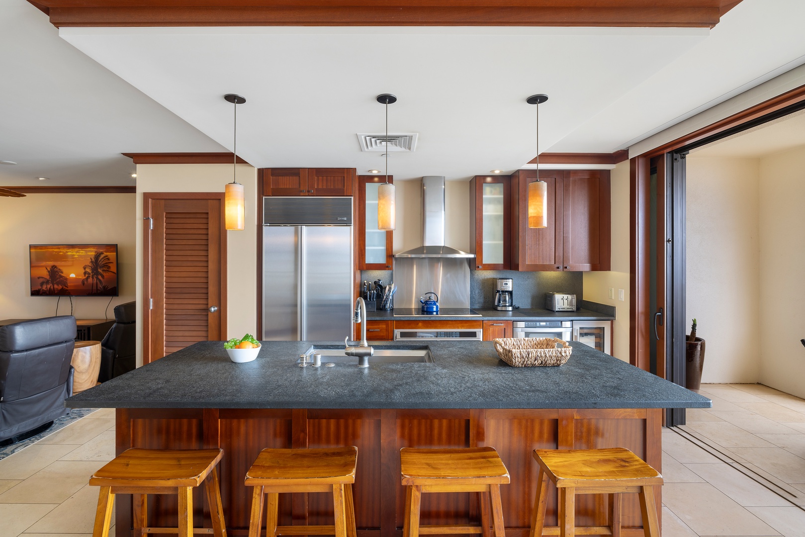 Kapolei Vacation Rentals, Ko Olina Beach Villas O1105 - The kitchen island seating for visiting with the chef and casual meals.