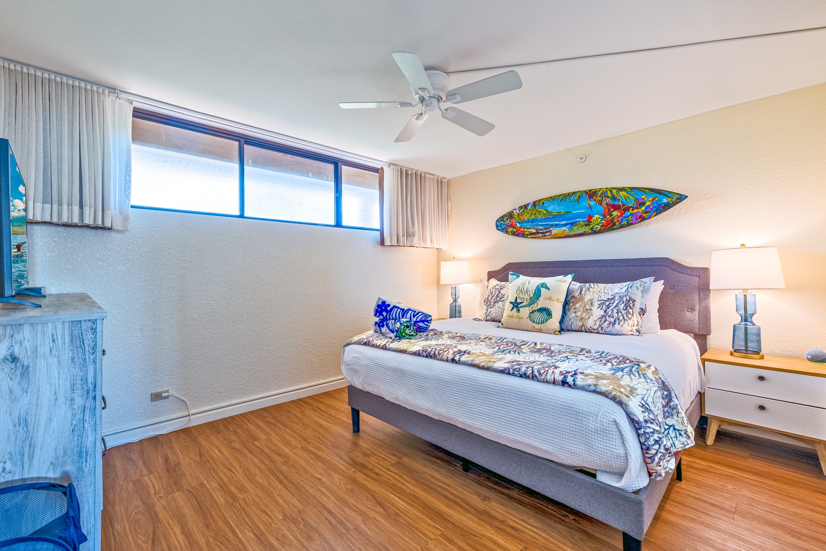 Lahaina Vacation Rentals, Kaanapali Shores 746 - The bedroom features a king-sized bed, colorful decor, and plenty of natural light from the large windows.