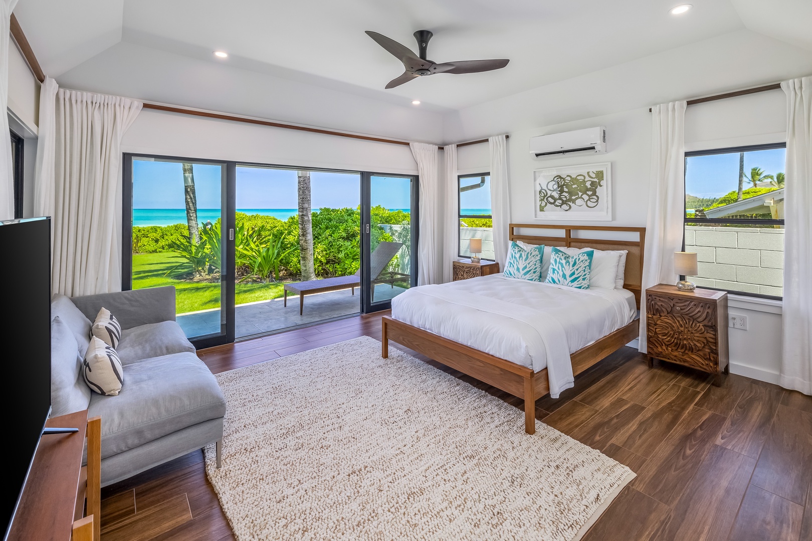 Kailua Vacation Rentals, Kailua Beach Villa - Third suite: Makai South with a queen bed, ocean view, split AC, and ceiling fan