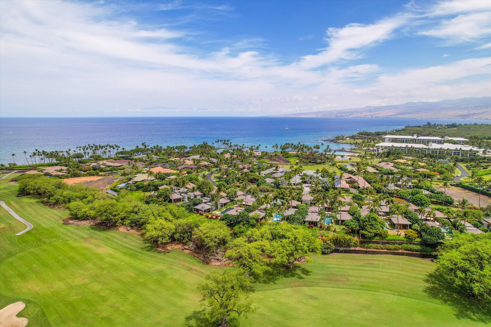 Kamuela Vacation Rentals, 3BD Na Hale 3 at Pauoa Beach Club at Mauna Lani Resort - Green fairways roll toward the coast, the ocean stretching along the far edge.