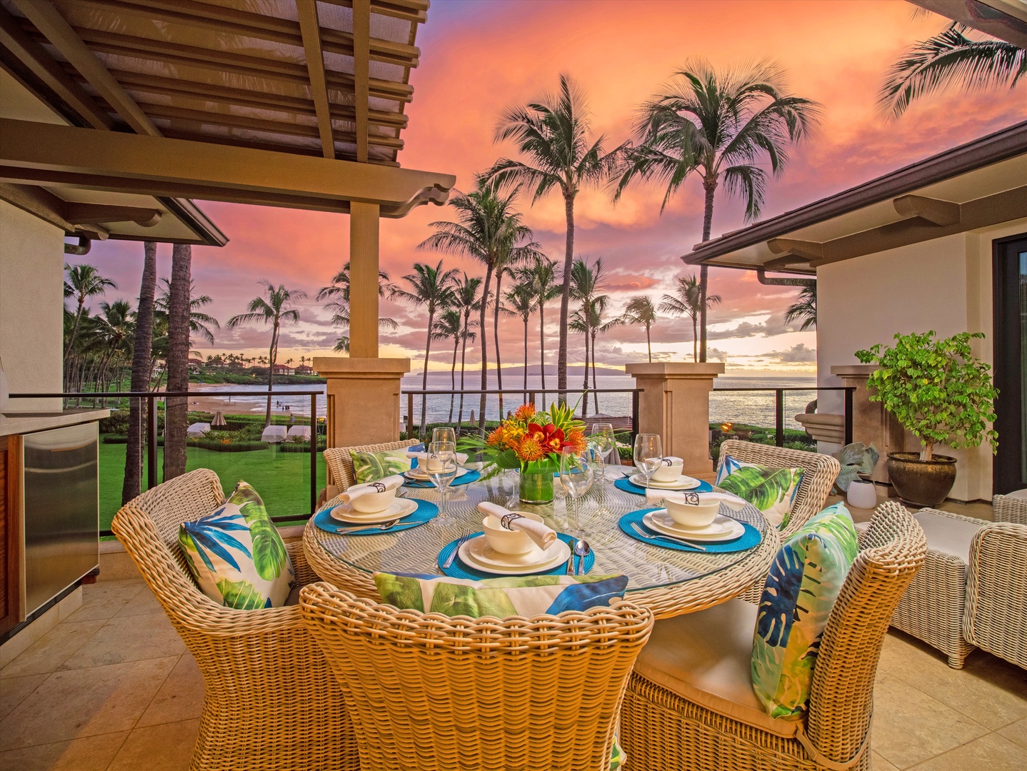 Wailea Vacation Rentals, Royal Ilima A201 at Wailea Beach Villas* - Alfresco dining area with a built-in BBQ, set against a backdrop of palm trees and ocean views.