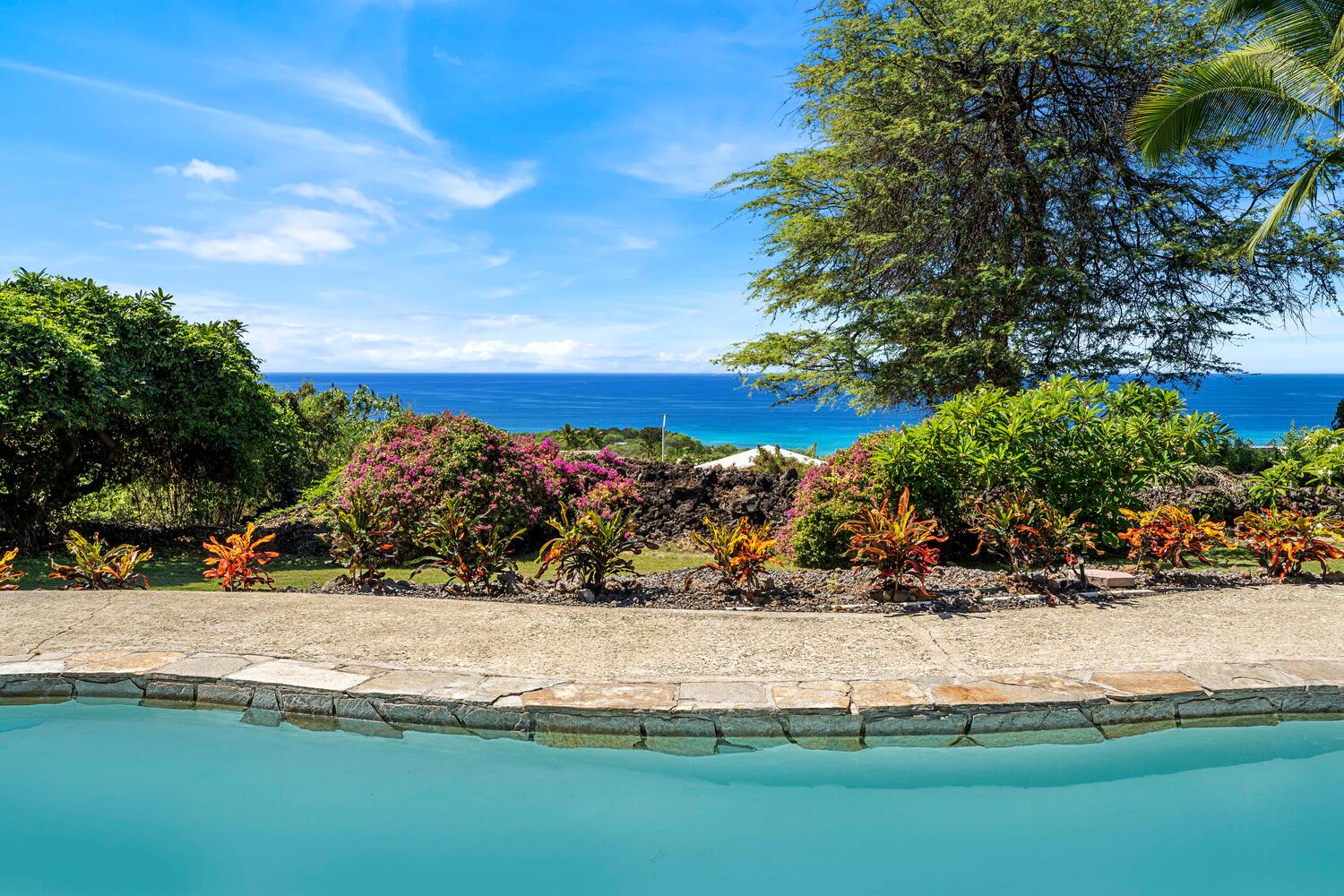 Kailua Kona Vacation Rentals, Ho'okipa Hale - Shallow 2-ft deep pool framed by lush landscaping—ideal for safe play and relaxation.