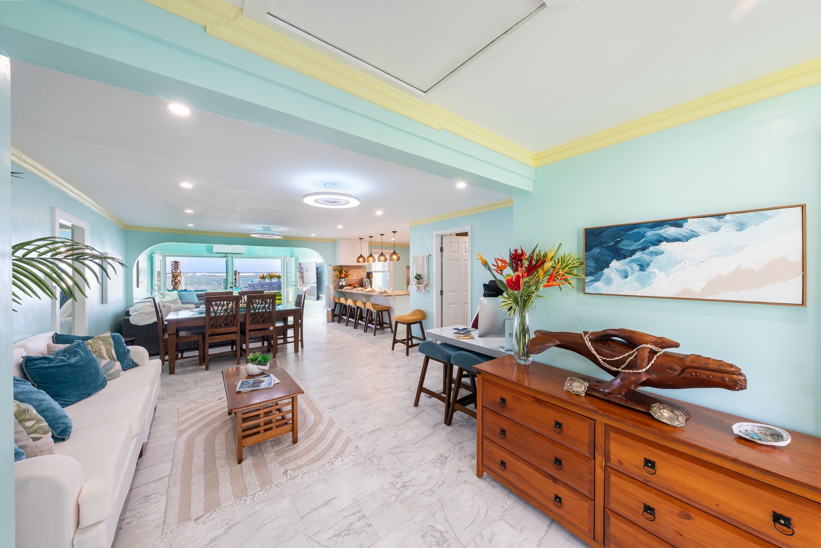 Hauula Vacation Rentals, Private Beach Paradise - Sunlit living space with ocean-inspired decor and seamless indoor-outdoor flow.