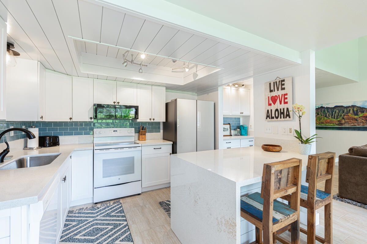 Princeville Vacation Rentals, Hale Hana Mana’o - Chef-ready kitchen with bar seating and coffee station—perfect for group stays.