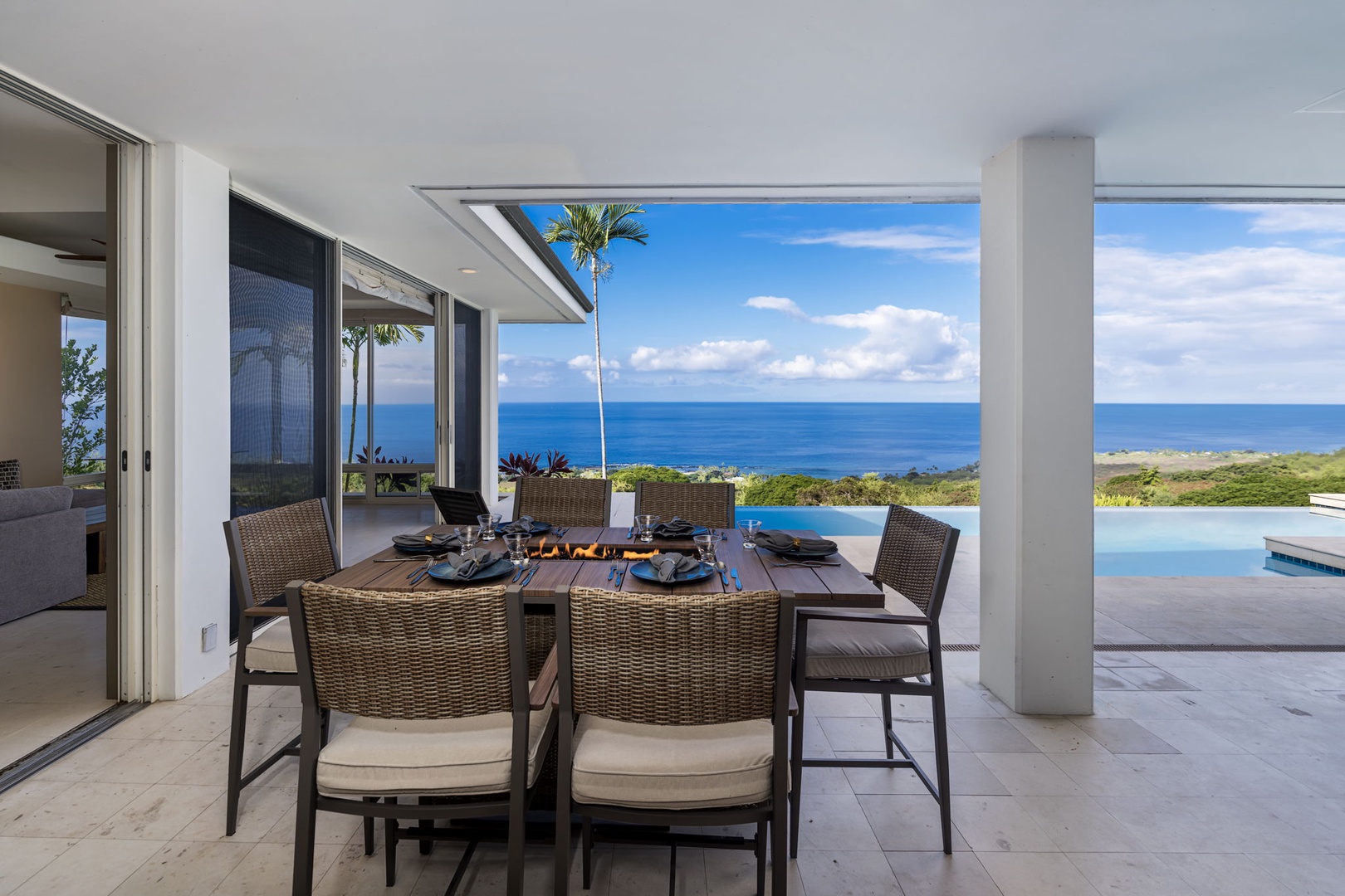 Kailua Kona Vacation Rentals, Hale Nai'a - Dine al fresco at your elegant outdoor table, where ocean breezes and stunning sea views create the perfect backdrop for memorable meals.