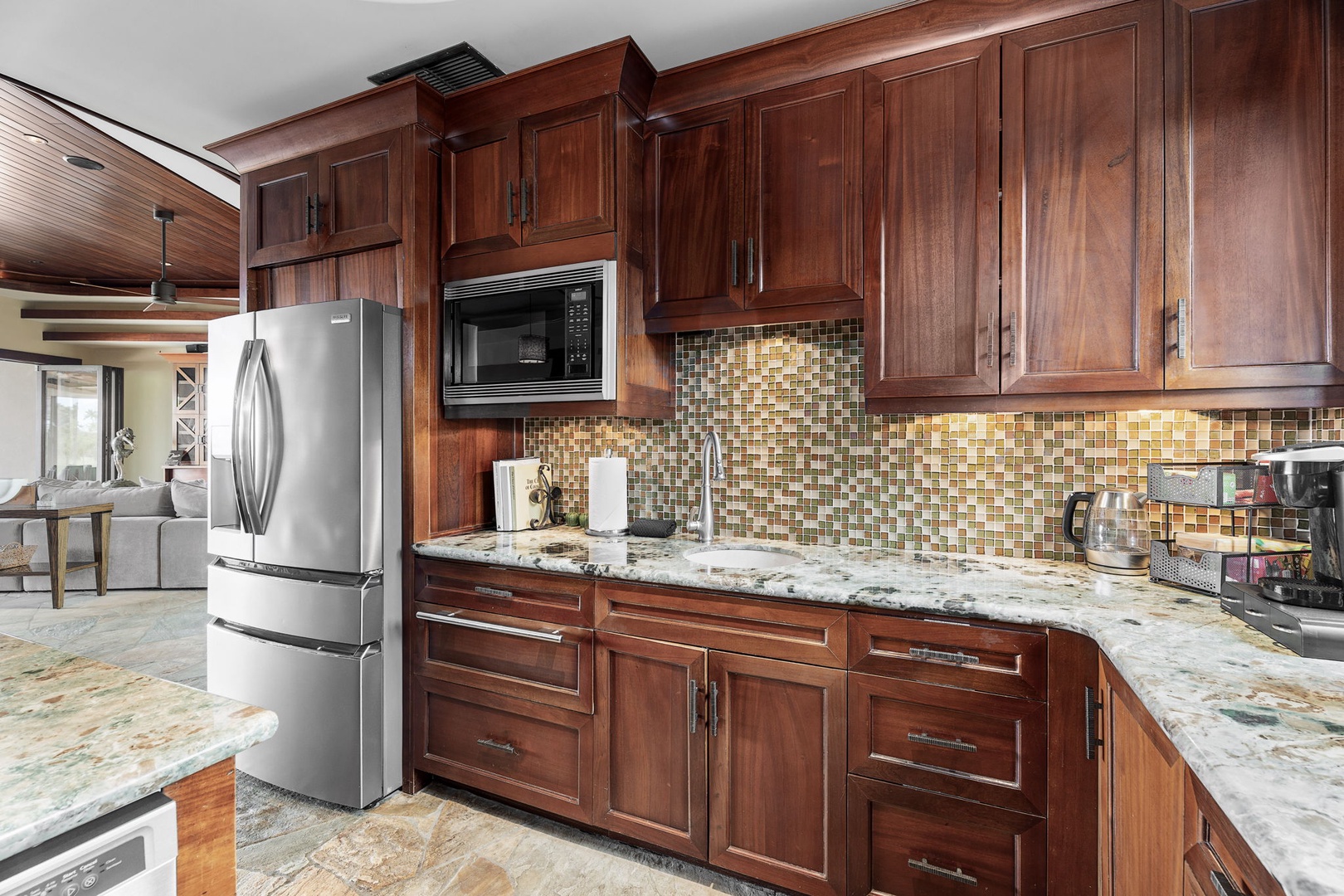 Kamuela Vacation Rentals, Hale Konane - Convenient kitchen with stainless steel appliances, custom cabinetry, and ample storage.