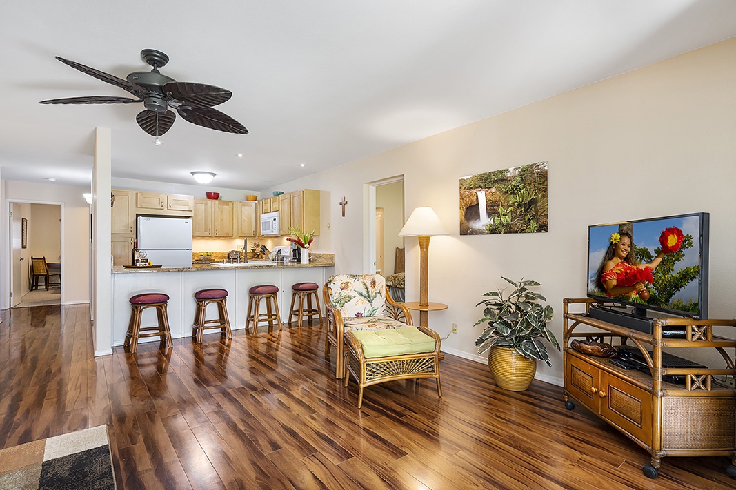 Waikoloa Vacation Rentals, Waikoloa Villas F-100 - Unwind after a day of island adventures with a movie night on the flat-screen TV in the spacious living room.