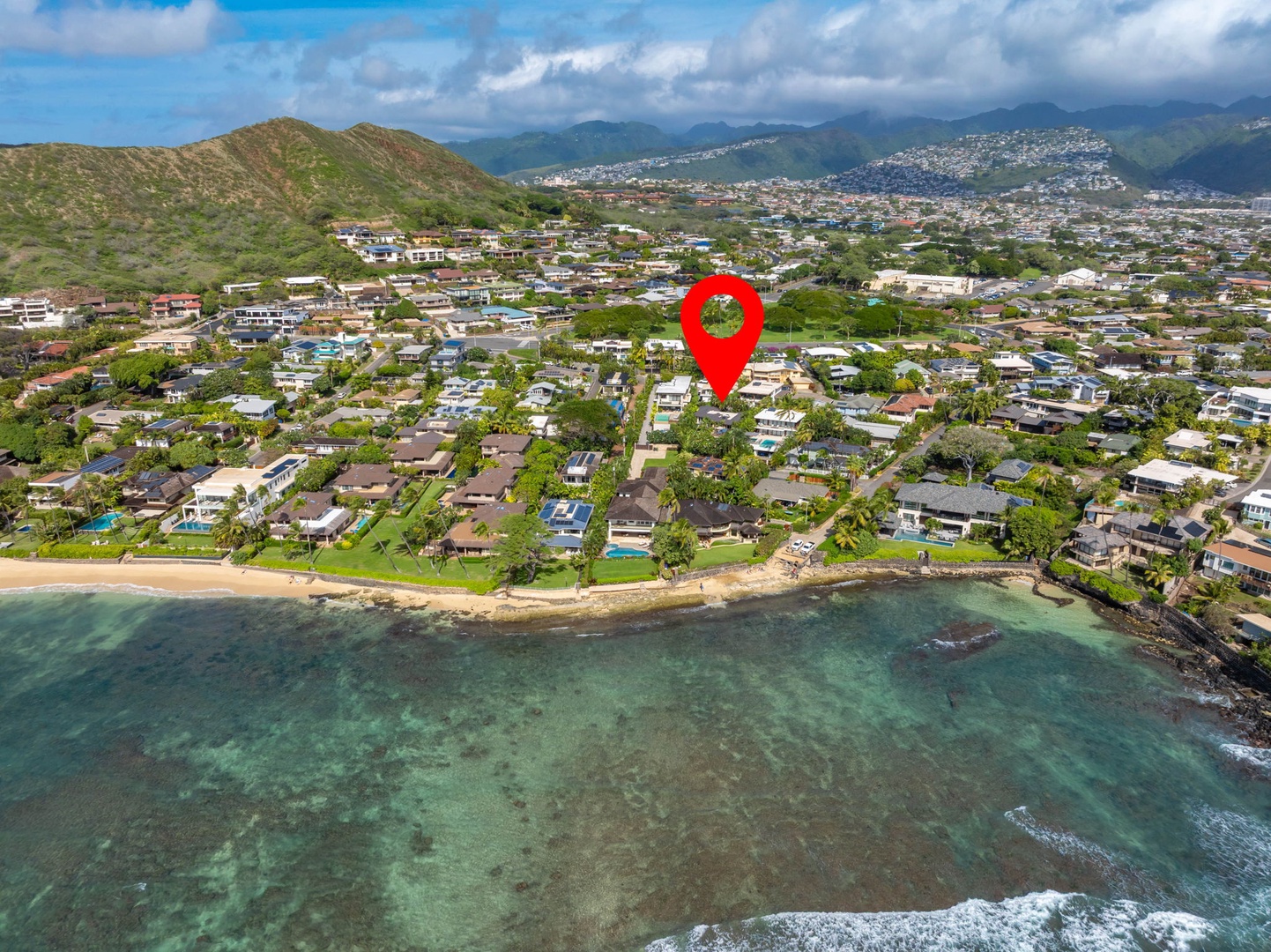 Honolulu Vacation Rentals, Diamond Head Luxe - Aerial view showcasing the location with crystal-clear waters and mountains surrounding the neighborhood.