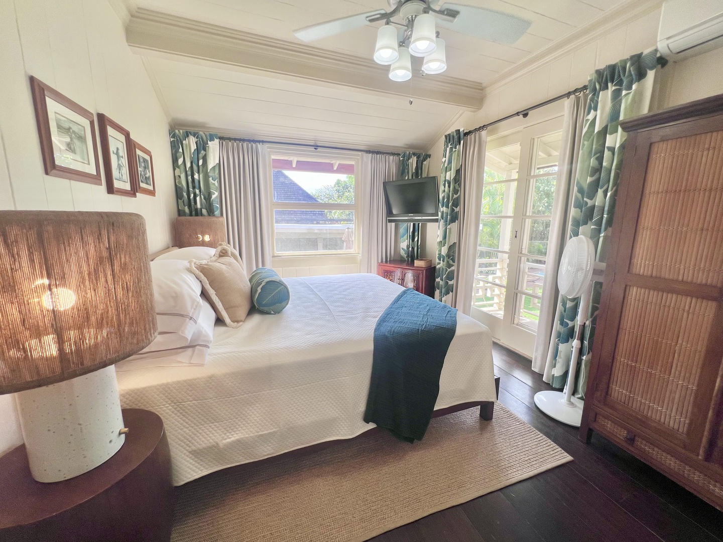 Honolulu Vacation Rentals, Kahala Palms - Guest bedroom with a queen-size bed, cozy decor, and serene garden views for a restful night