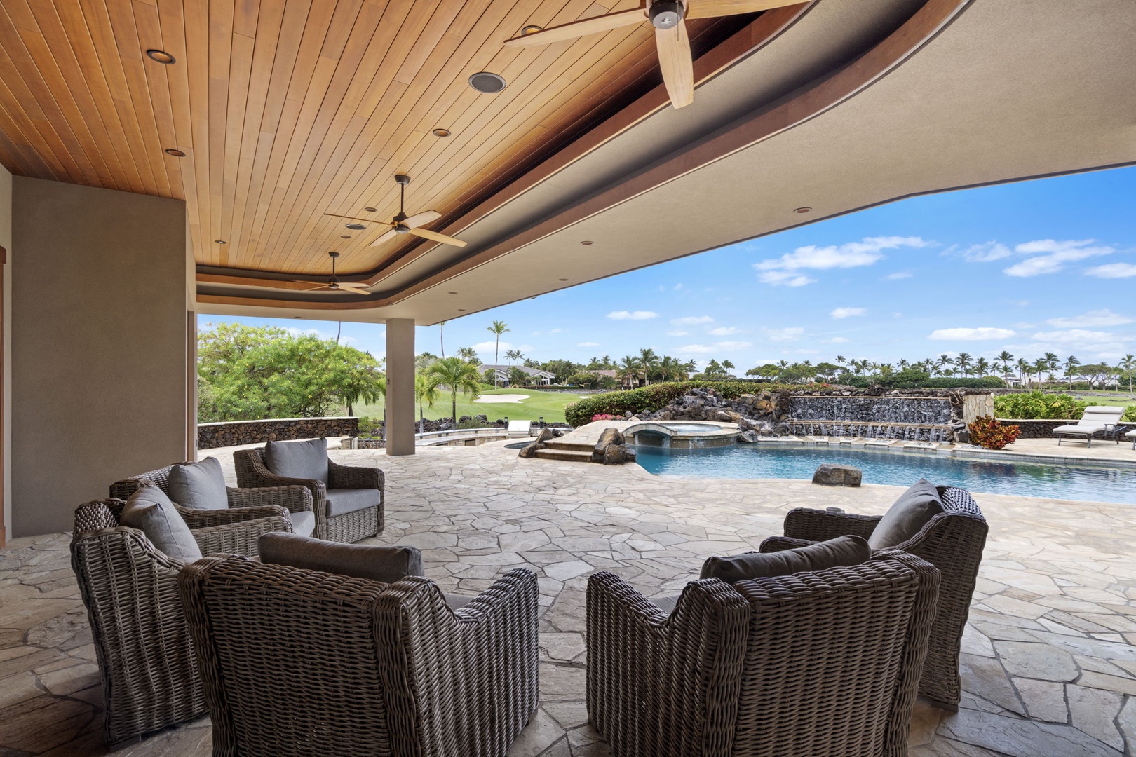 Kamuela Vacation Rentals, Hale Konane - Covered outdoor lounge with plush seating, ideal for relaxing by the pool.