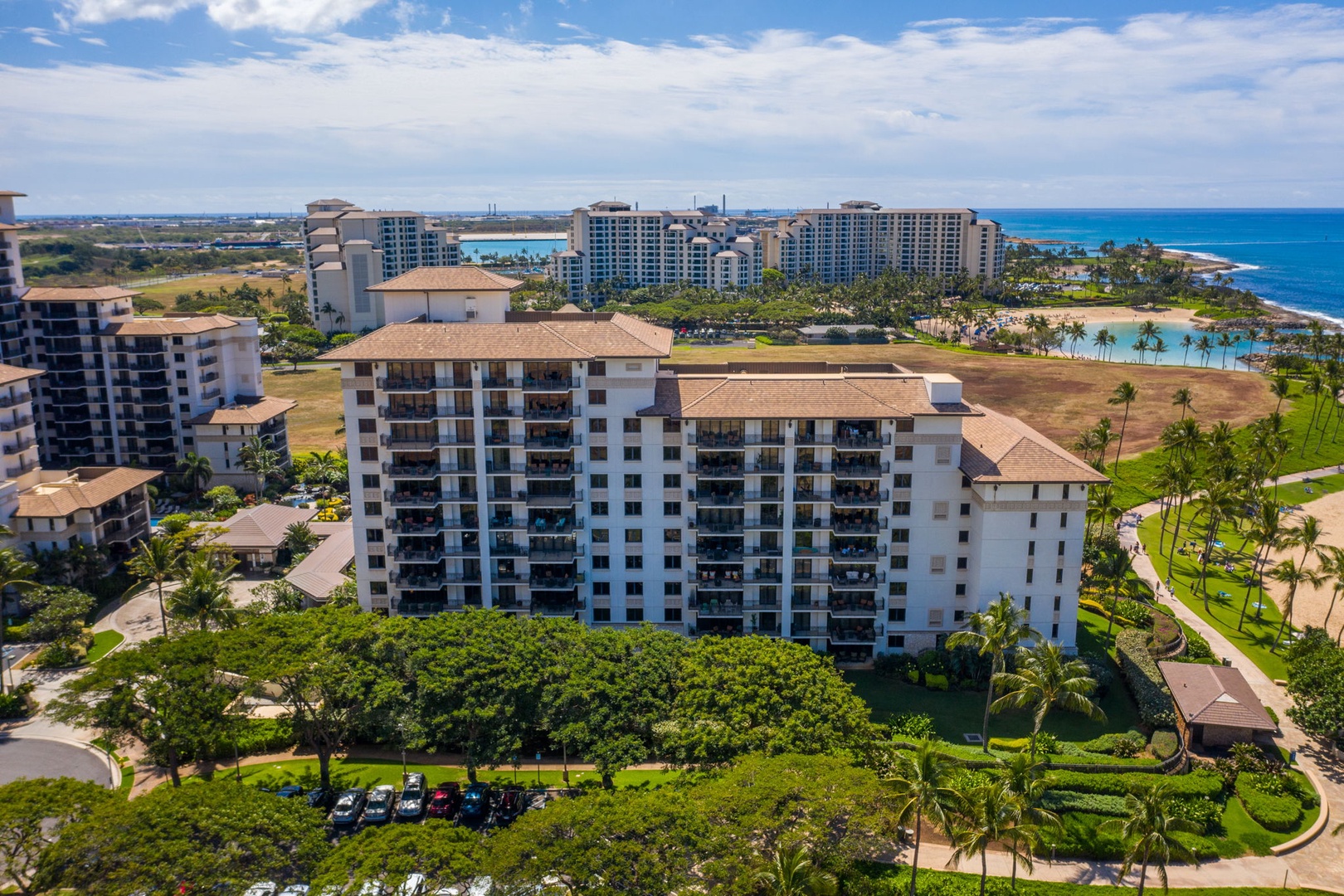 Kapolei Vacation Rentals, Ko Olina Beach Villas B604 - Aerial view of beachfront resort buildings with tropical landscaping and ocean access in this coastal vacation destination.