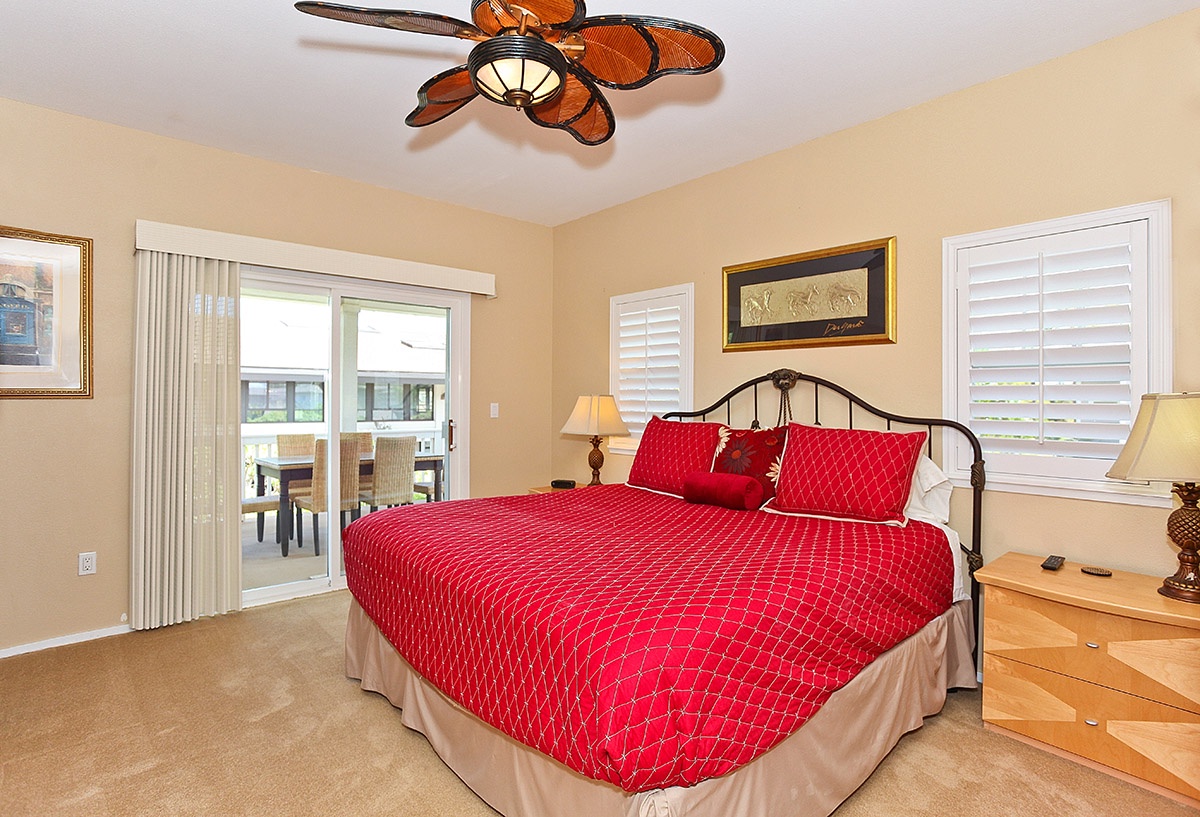 Kapolei Vacation Rentals, Coconut Plantation 1078-3 - The primary guest bedroom with access to the patio.