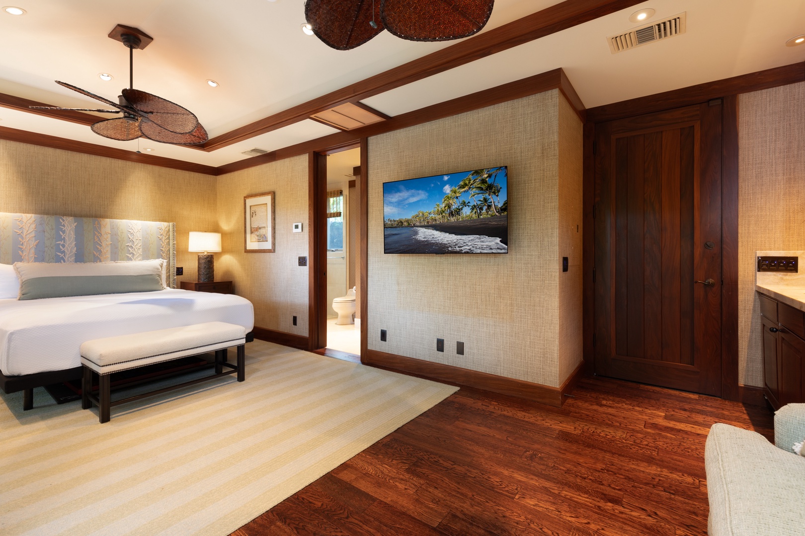 Kailua Kona Vacation Rentals, 5BD Ke Alaula Estate (144) at Hualalai Resort - Comfortable bedroom with smart TV, kitchenette and warm wood finishes.