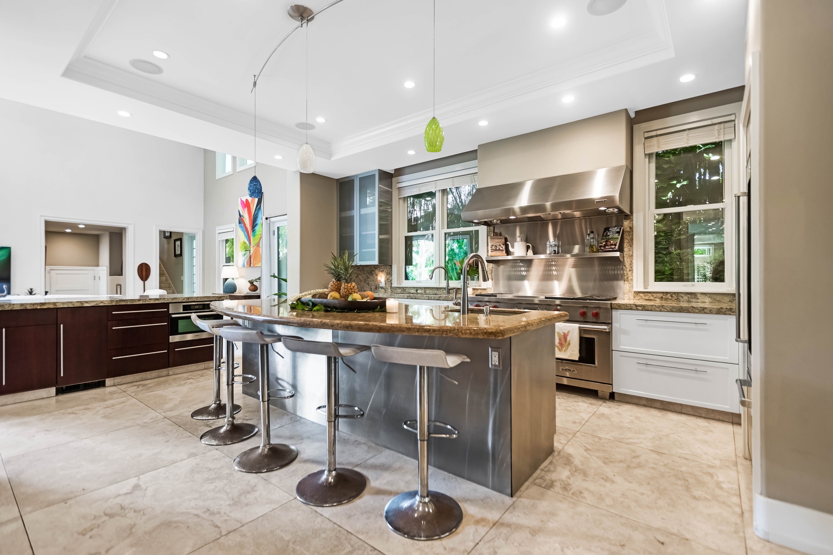 Honolulu Vacation Rentals, Pili Pono - Sleek island with bar seating under elegant pendant lights.